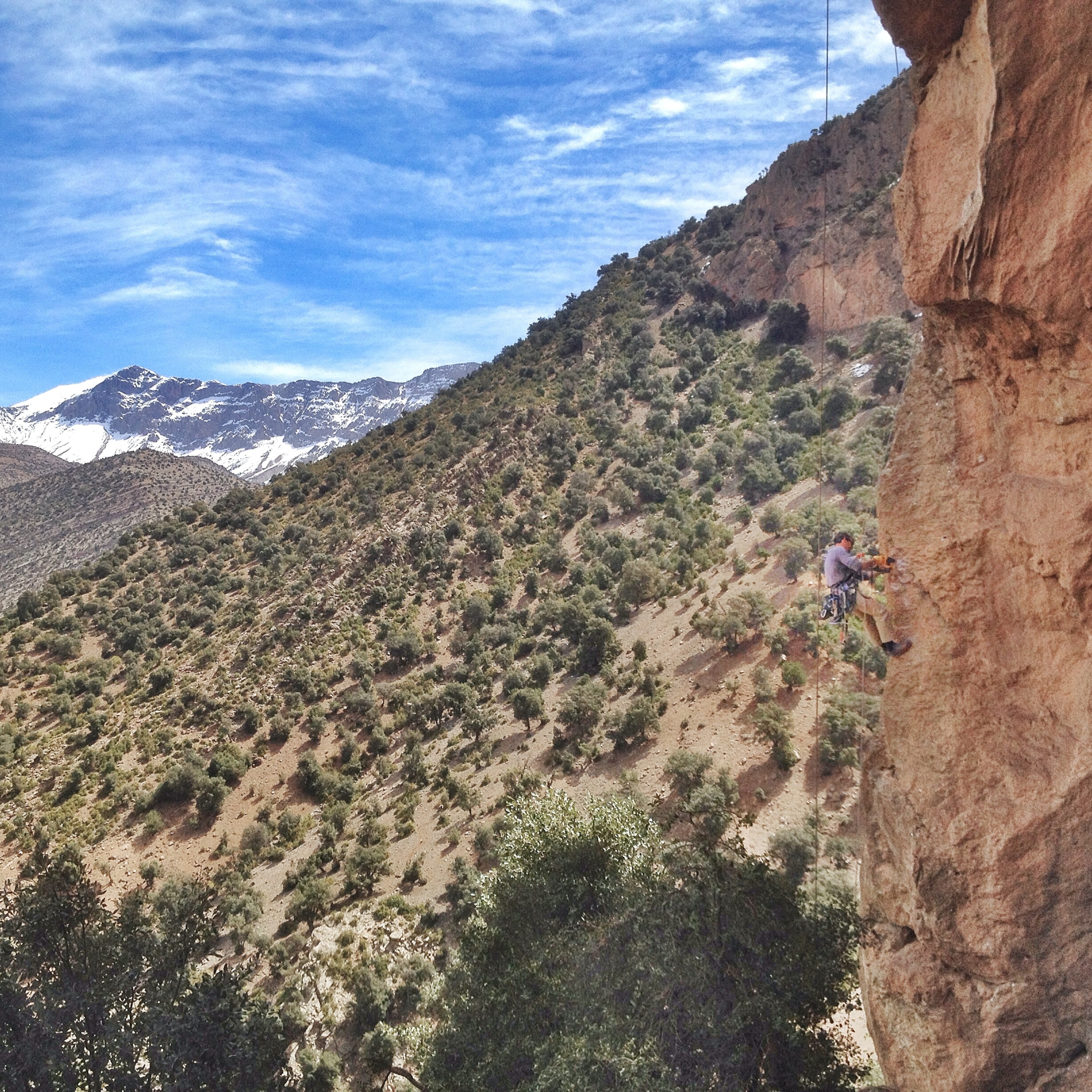 Kris Erickson bolting a new climbing route; Photograph by Sam Elias