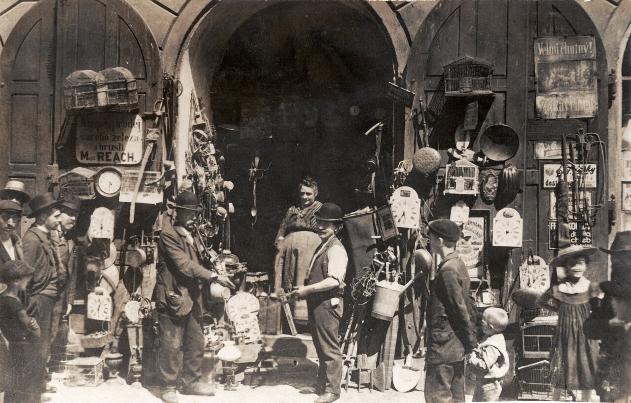 Photo of street scene with vendors selling clocks