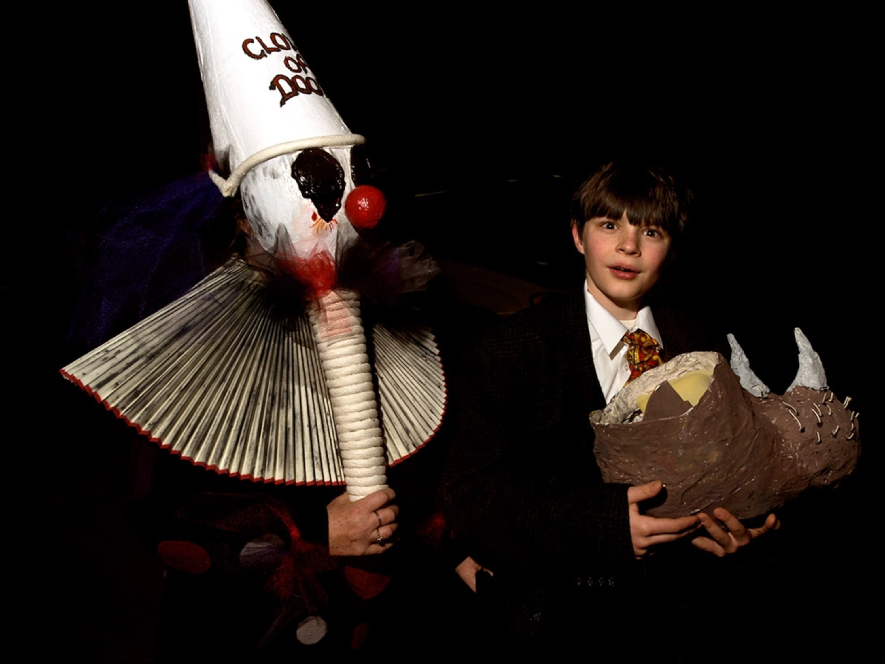 A costumed person and boy