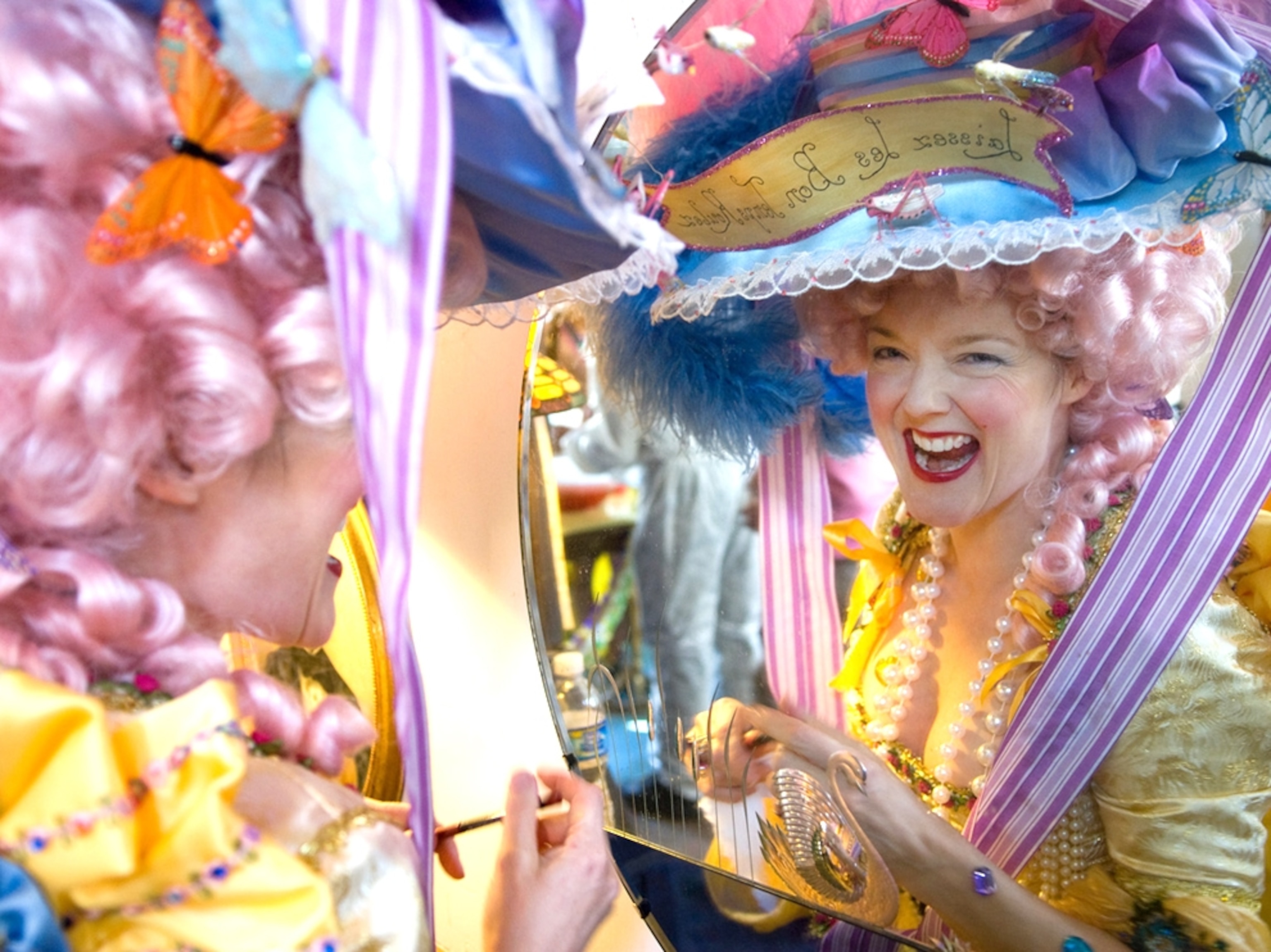 Woman dressed as Marie Antoinette prepares for parade, Mardi Gras, New Orleans