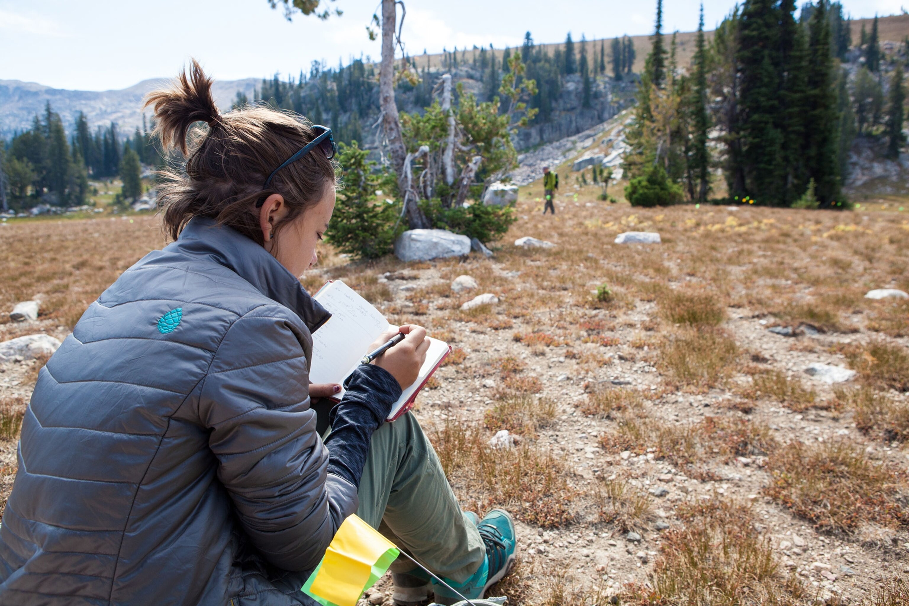 Rebecca Sgouros taking notes during the recording of a 3,000 year old campsite