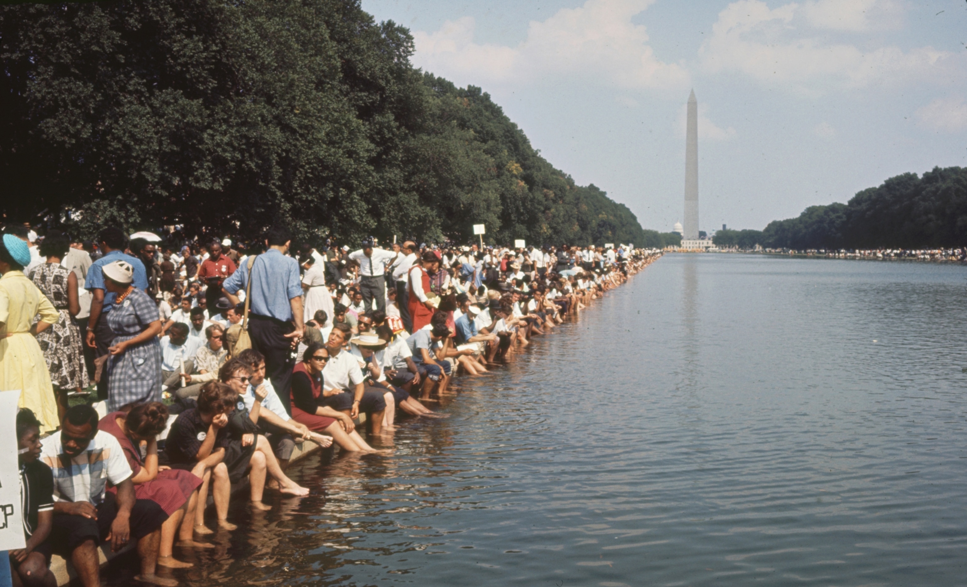 Civil rights demonstrators wade in water in the mall.