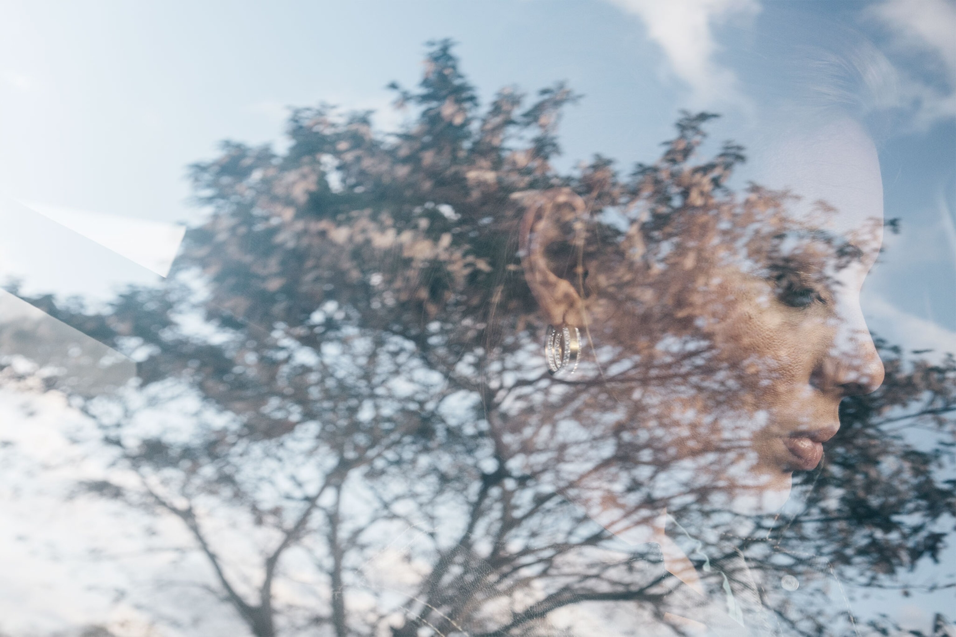 a woman seen through a window