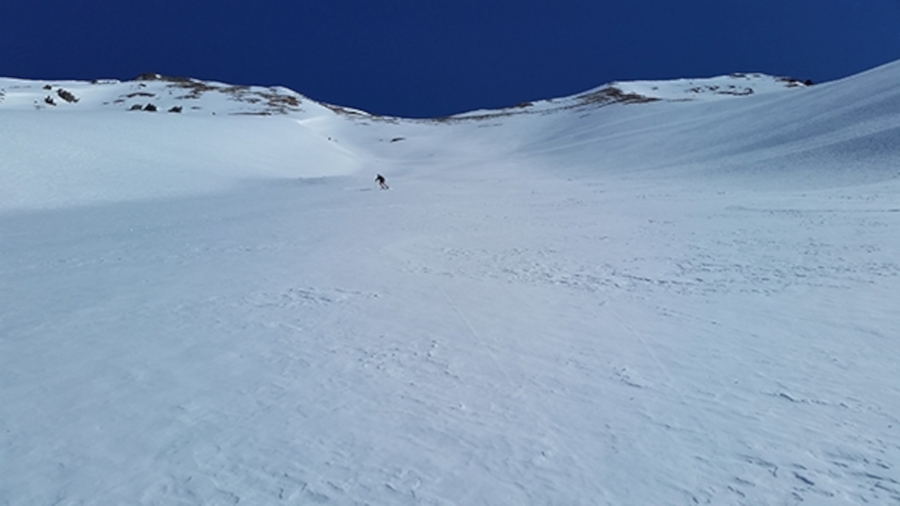 Paul Hamilton skiing down into Ophir, Colorado; Photograph by Jason Schlarb