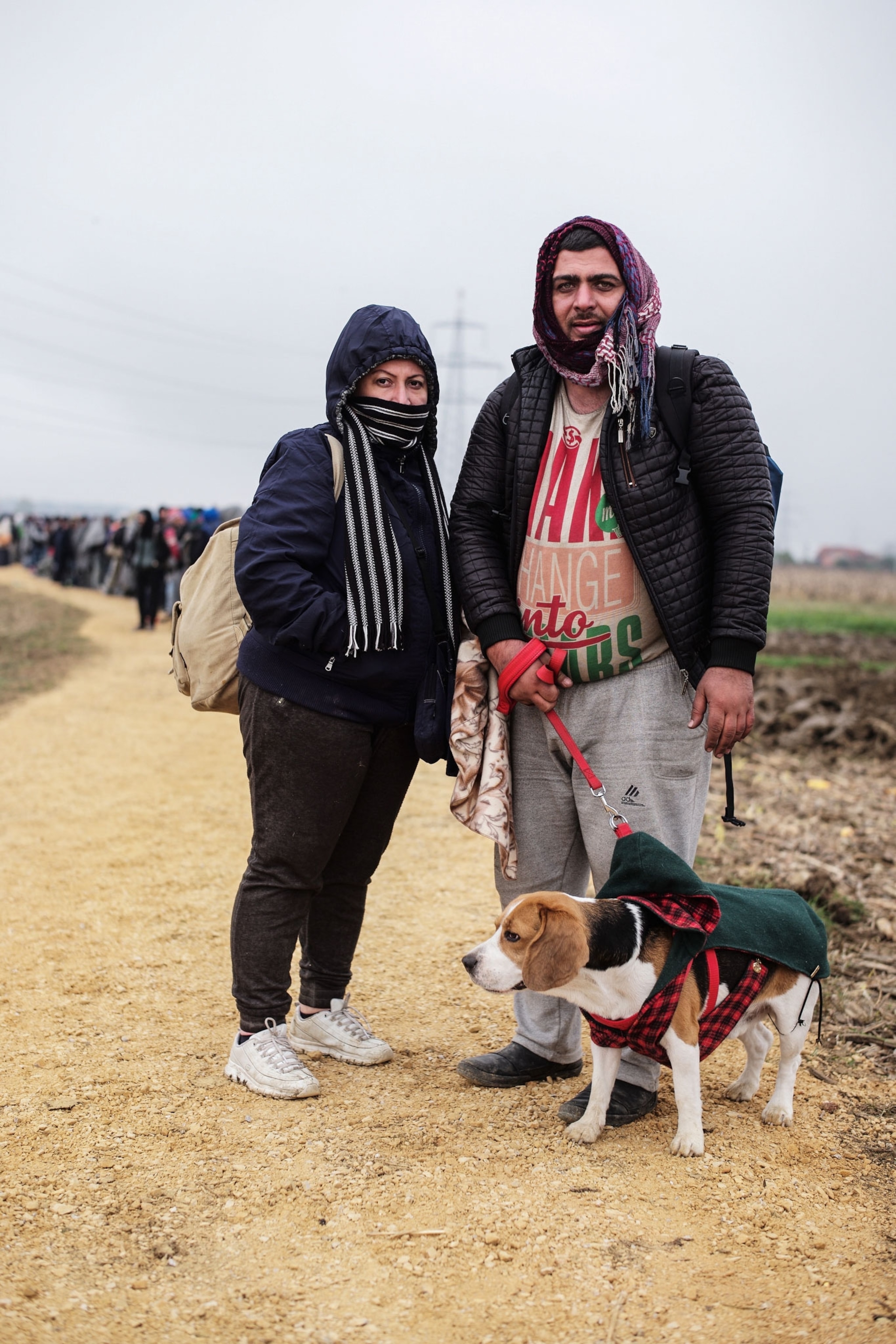 a couple of refugees and their dog