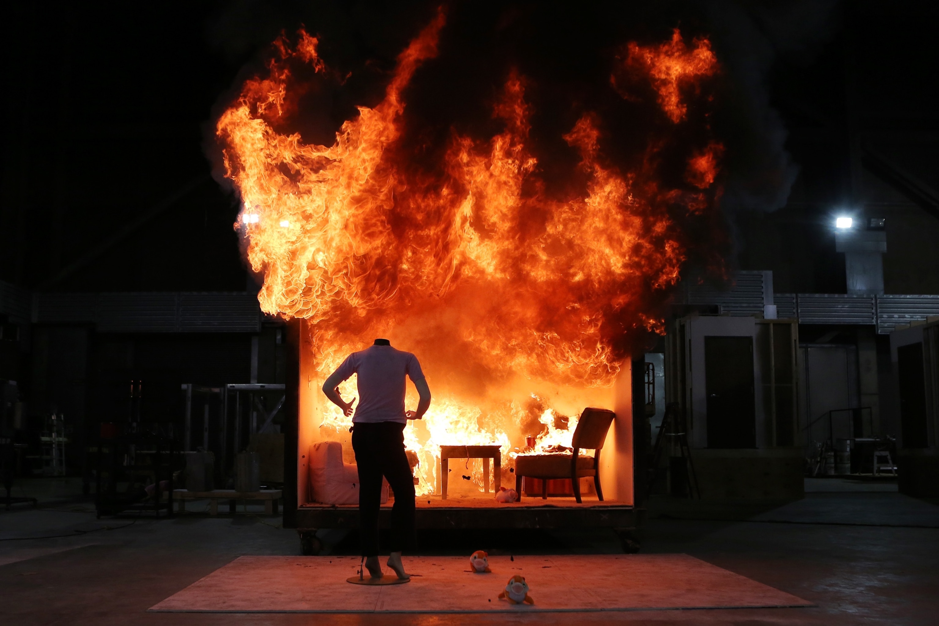 a controlled burn demonstration burning a room and mannequin