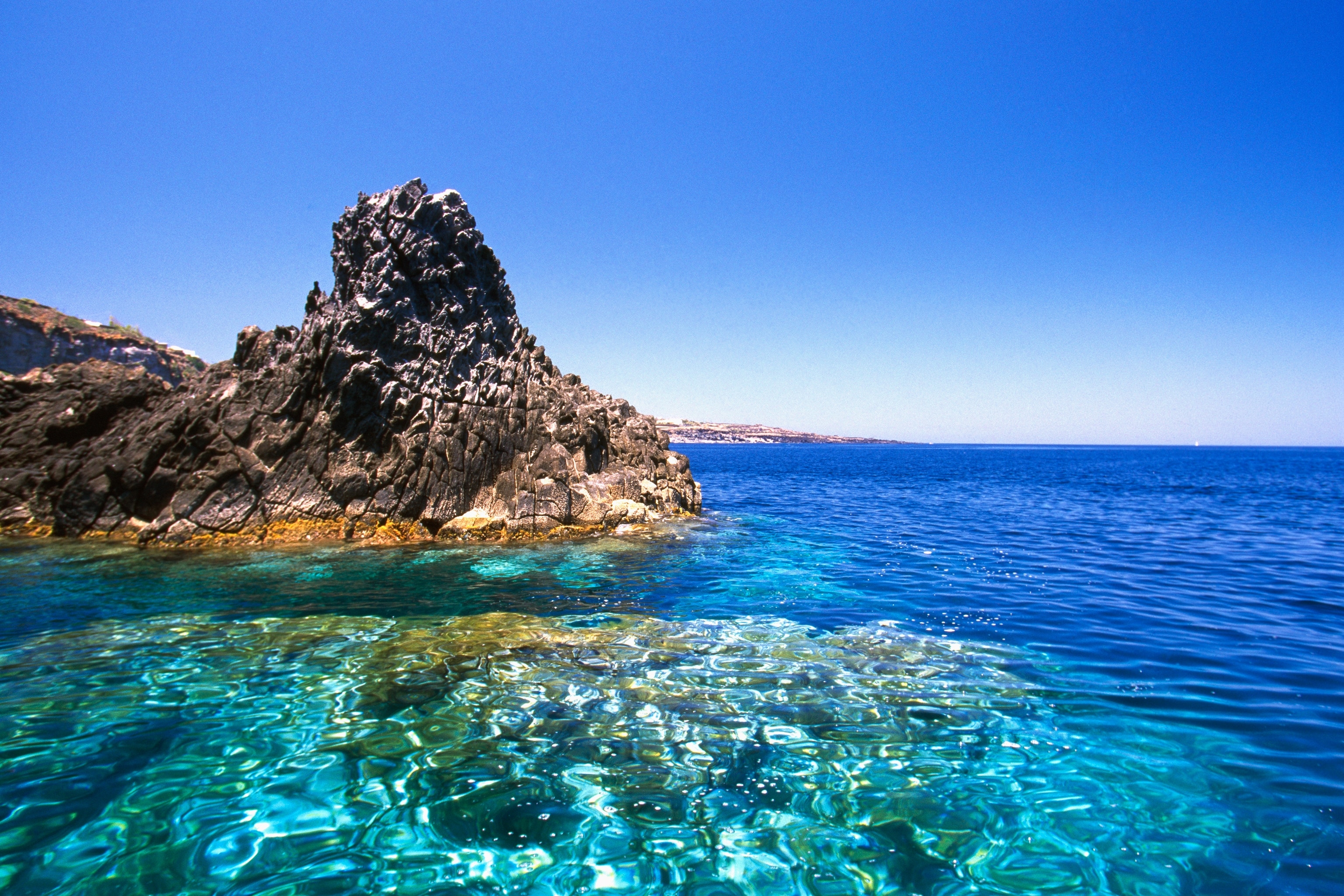 Island rock and clear waters