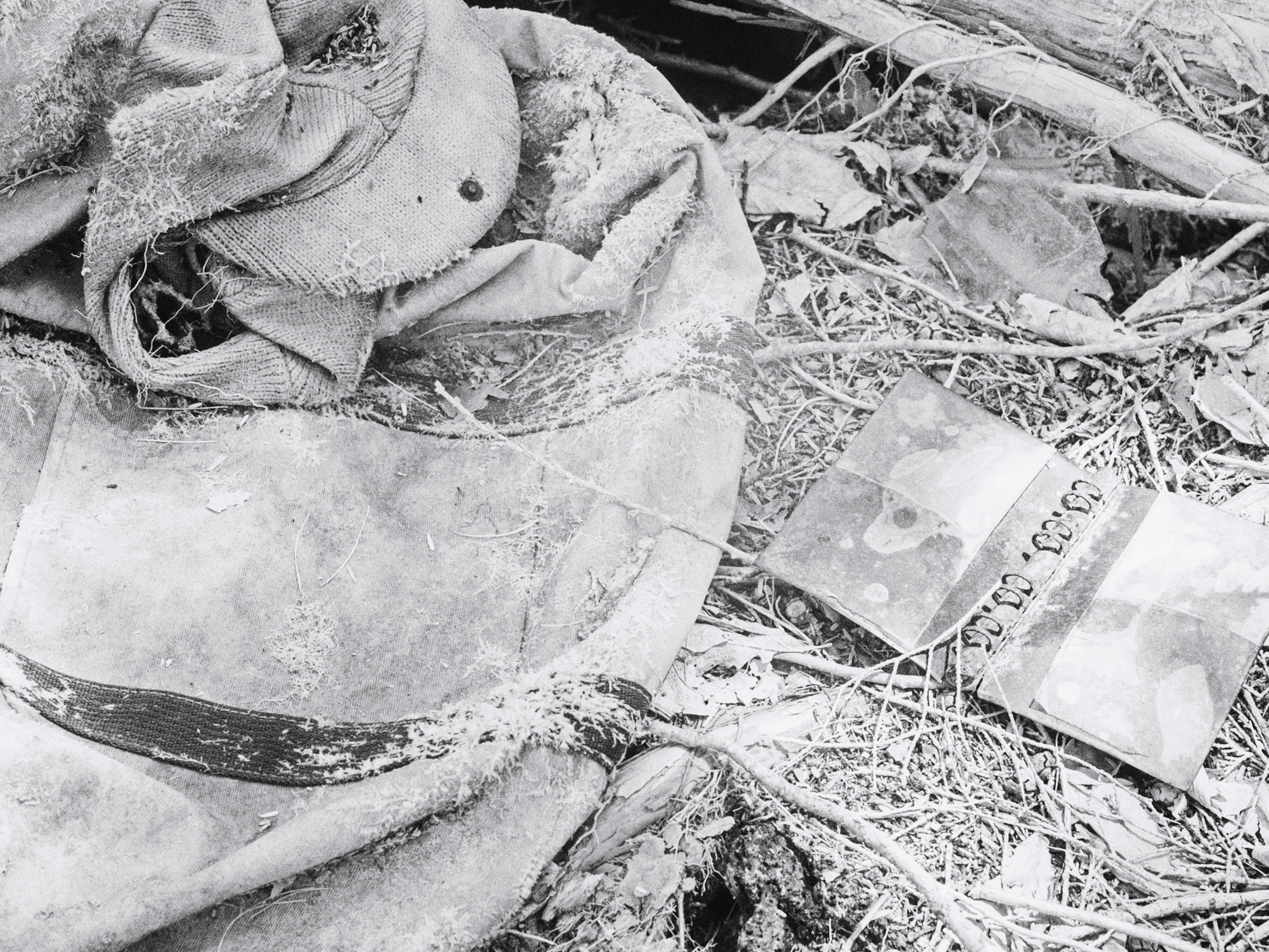 Black and white picture of belongings left behind