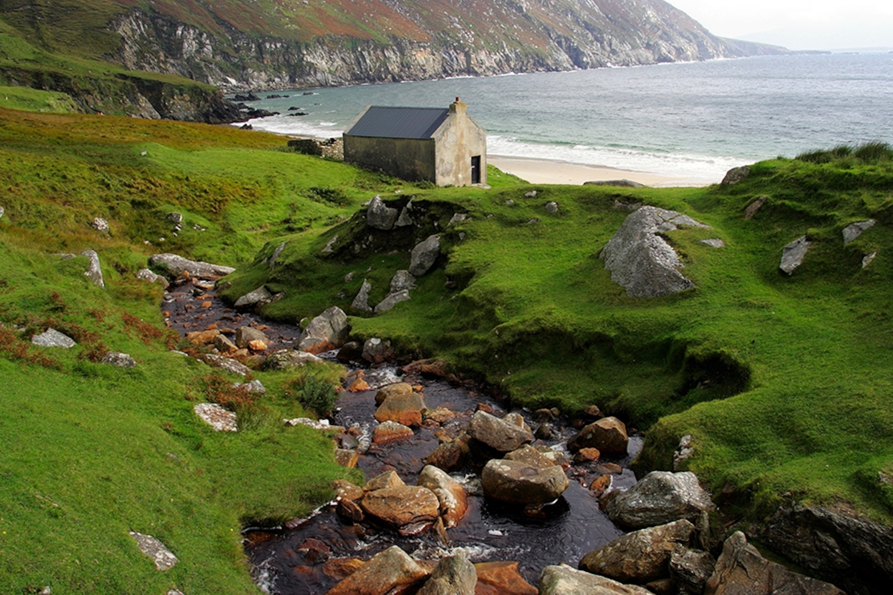 a stone cottage on coast near Keel, Ireland