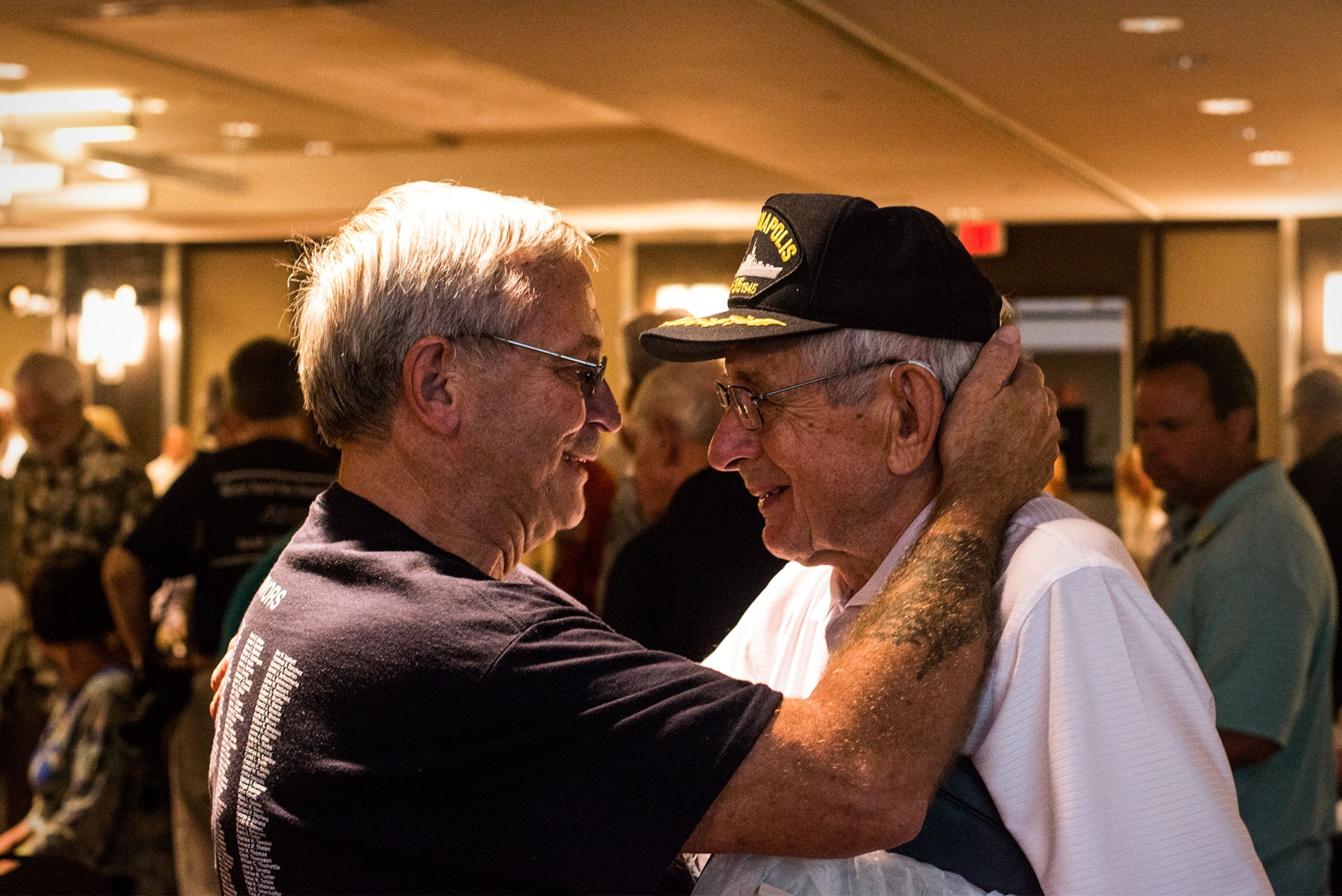 a survivor of the sinking of the USS Indianapolis with an attendant of the reunion