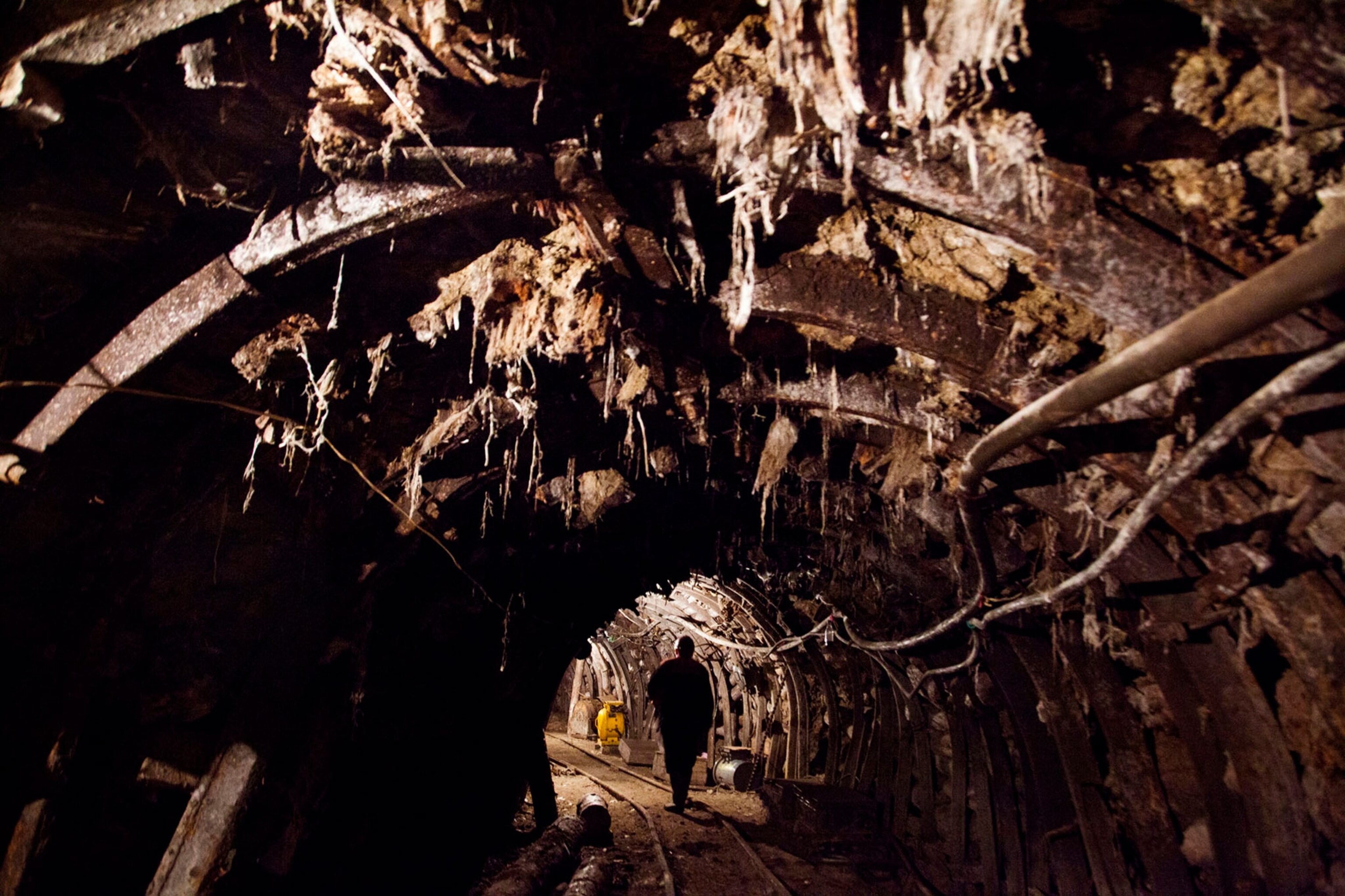 a miner walking along a mine tunnel in Chiatura, Georgia