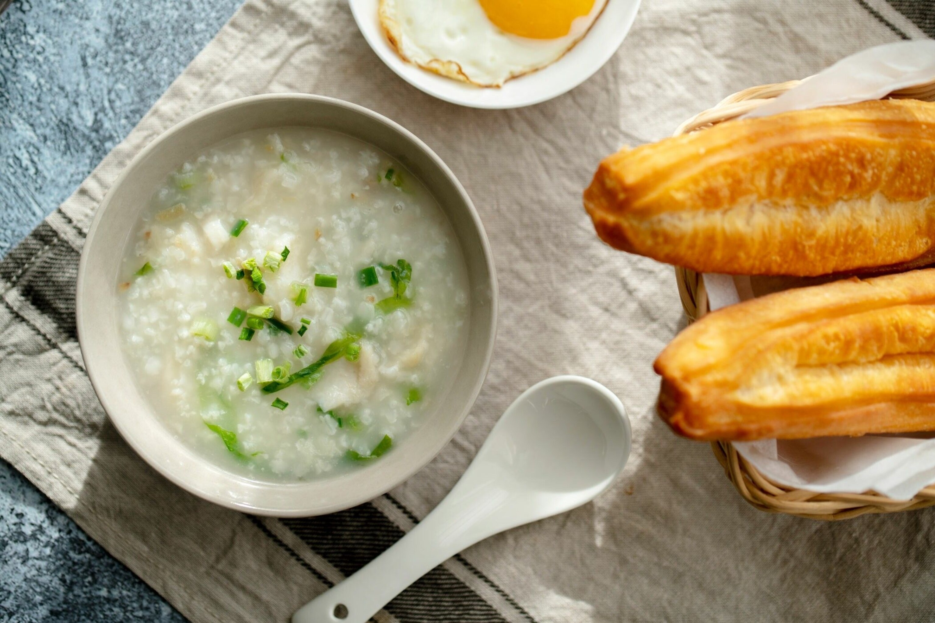 China's rice-porridge breakfast dish, congee, can sounds a bit bland to the uninitiated. Switch it up with toppings like garlic, ginger or sliced spring onions, or serve with airy, fried dough sticks (youtiao) for dunking.