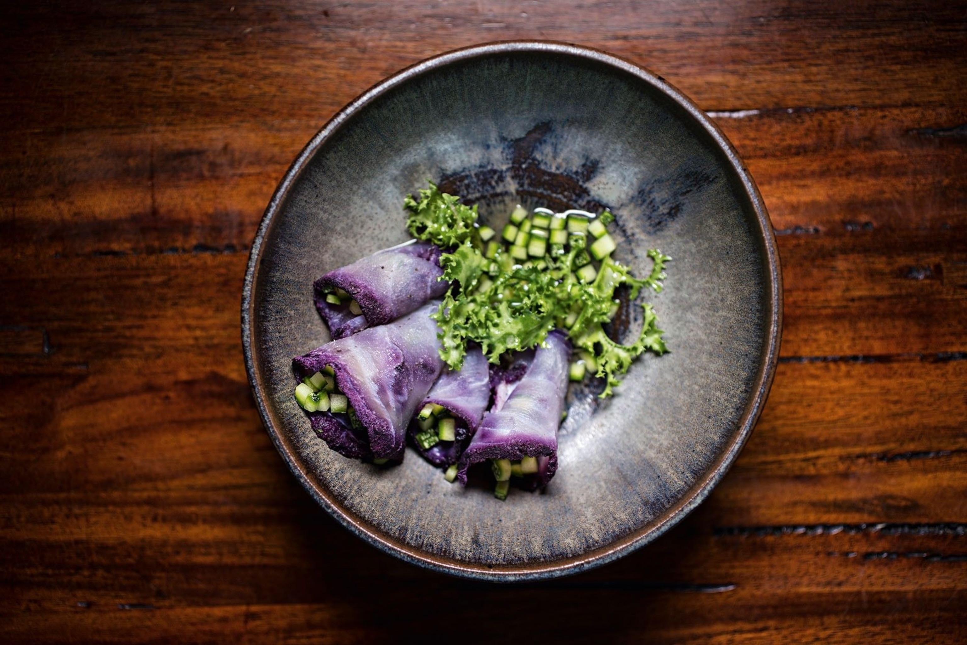 A plate of cured alligator served with Andean cucumber.