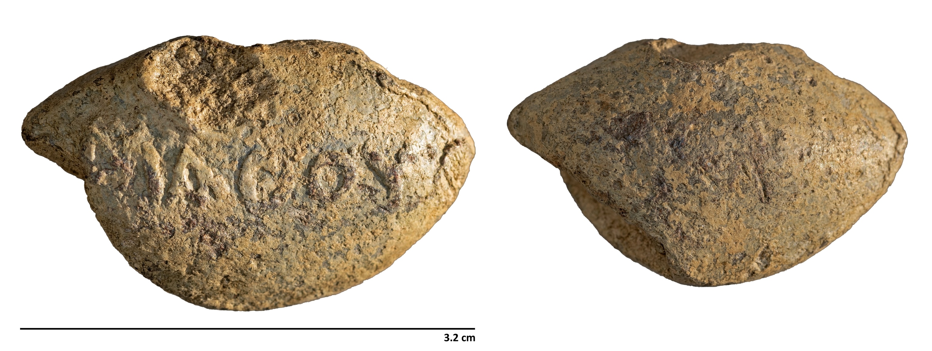An inscribed bullet is photographed against a white background.