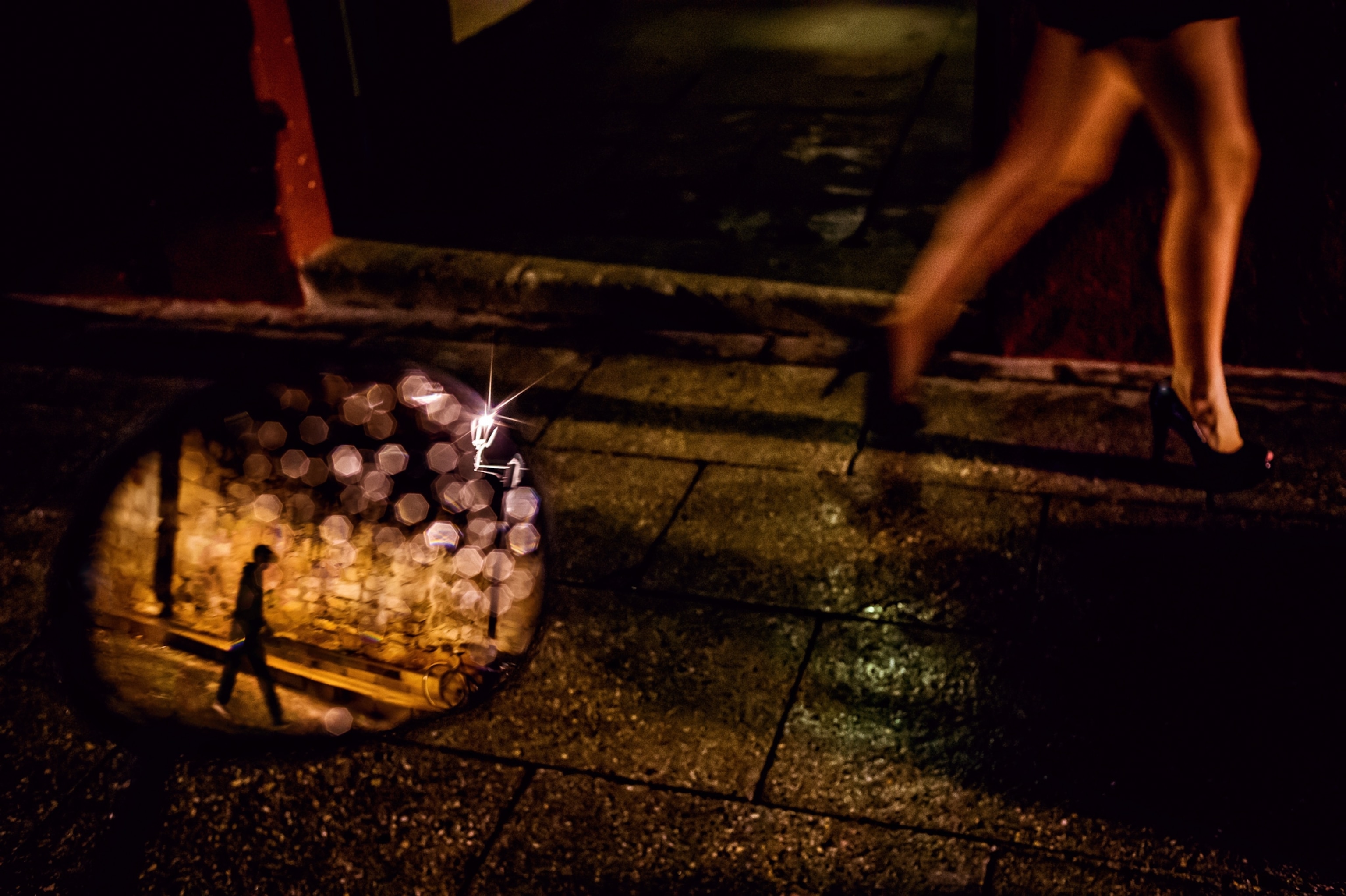 a person walking and a reflection of another person in a mirror, Oaxaca