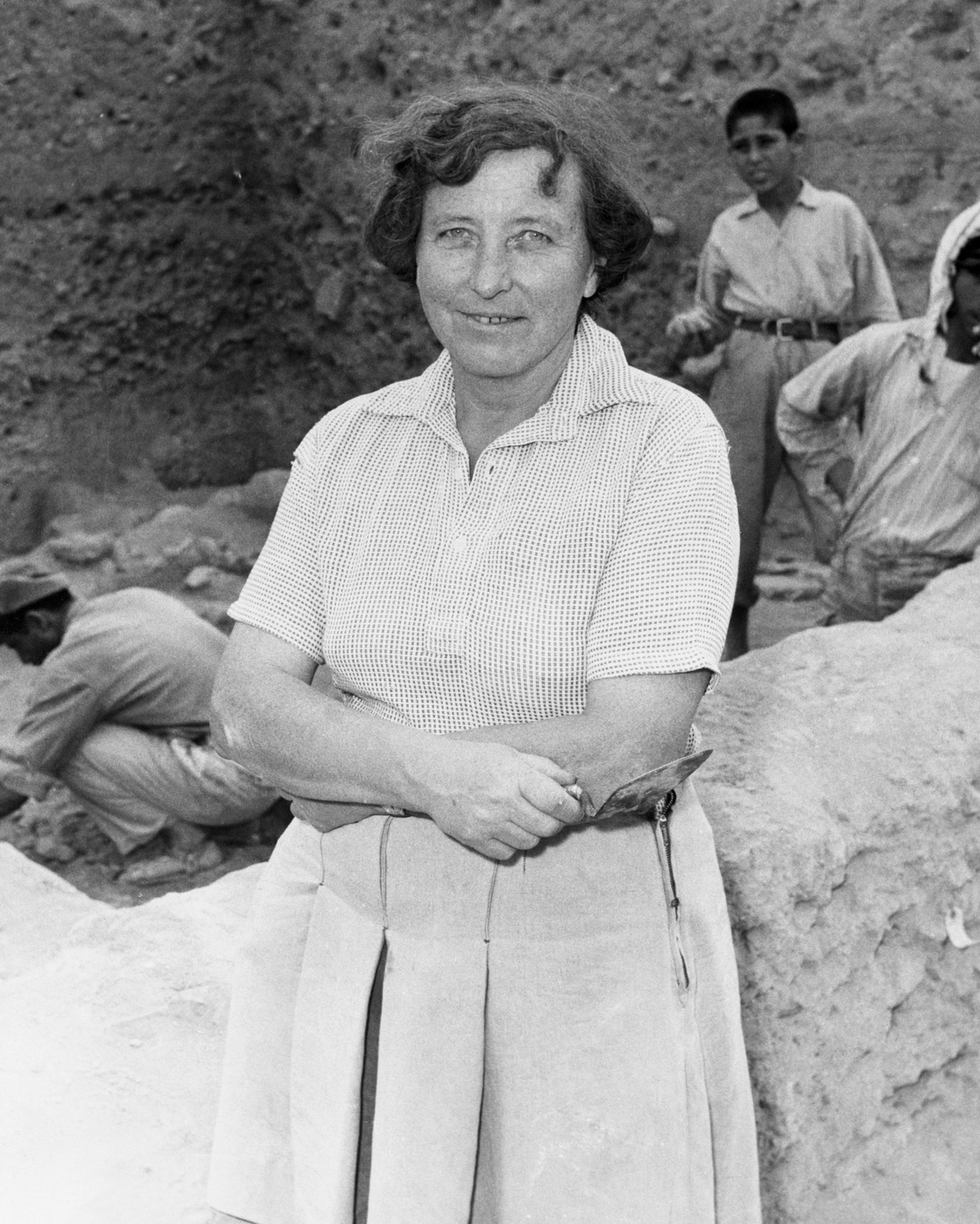Excavating at Jericho. Doctor Kathleen Kenyon, Director of the British School of archeology in Jerusalem, and leader of the current diggings here in Jericho, stands by the site.