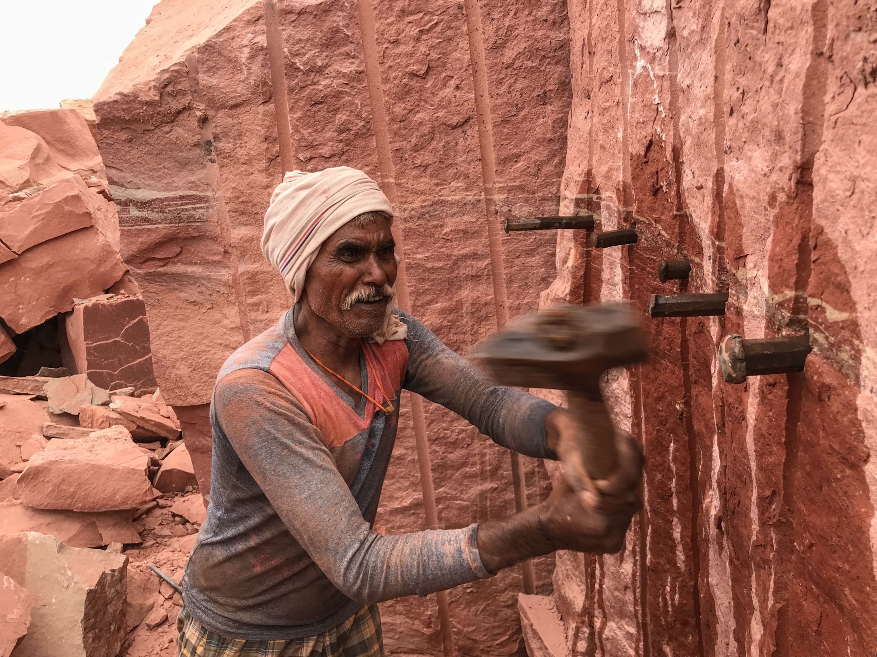 men working in a quarry in India