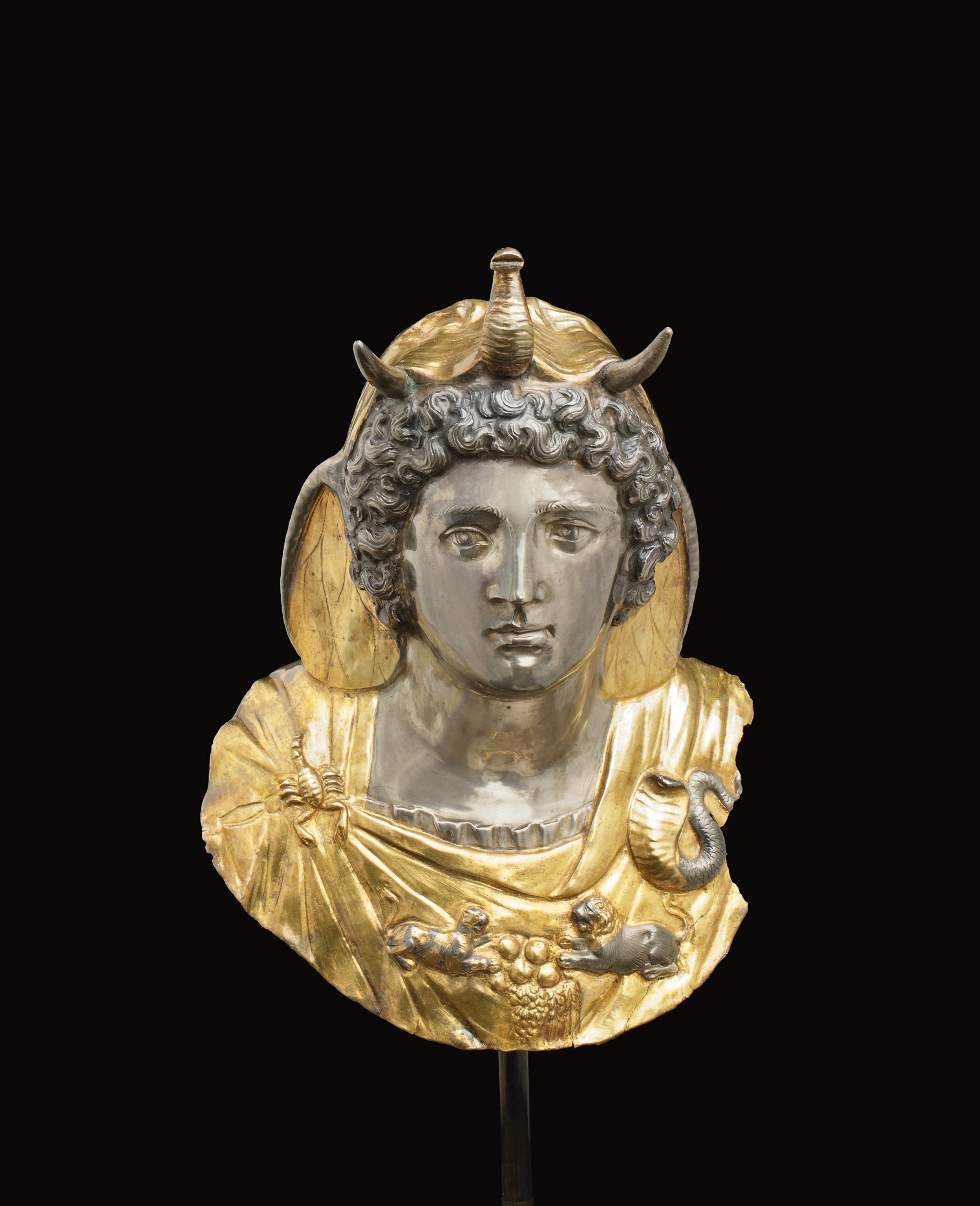 A gold and silver statue of the head of a woman.