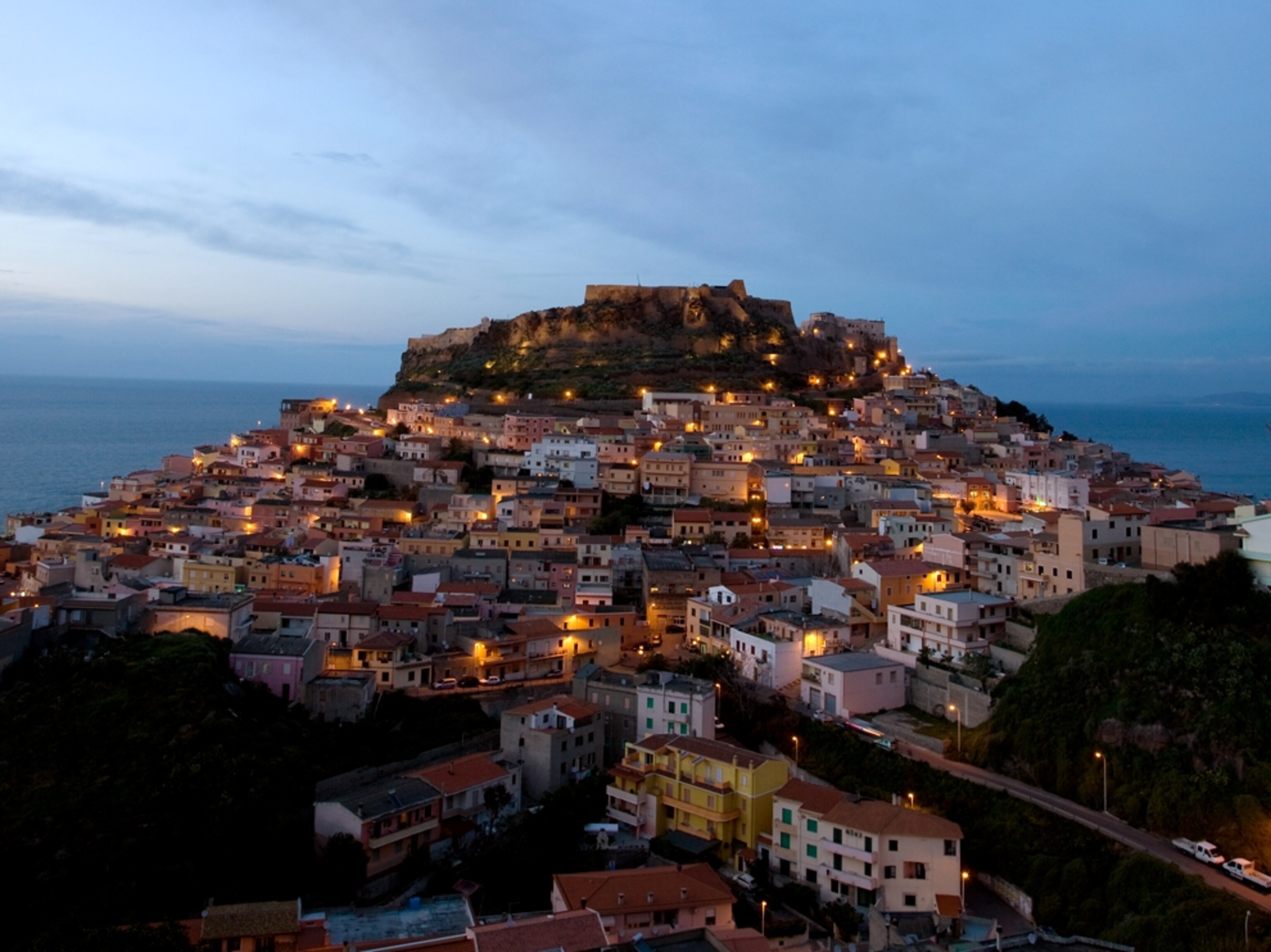 Sunset over house-filled hill