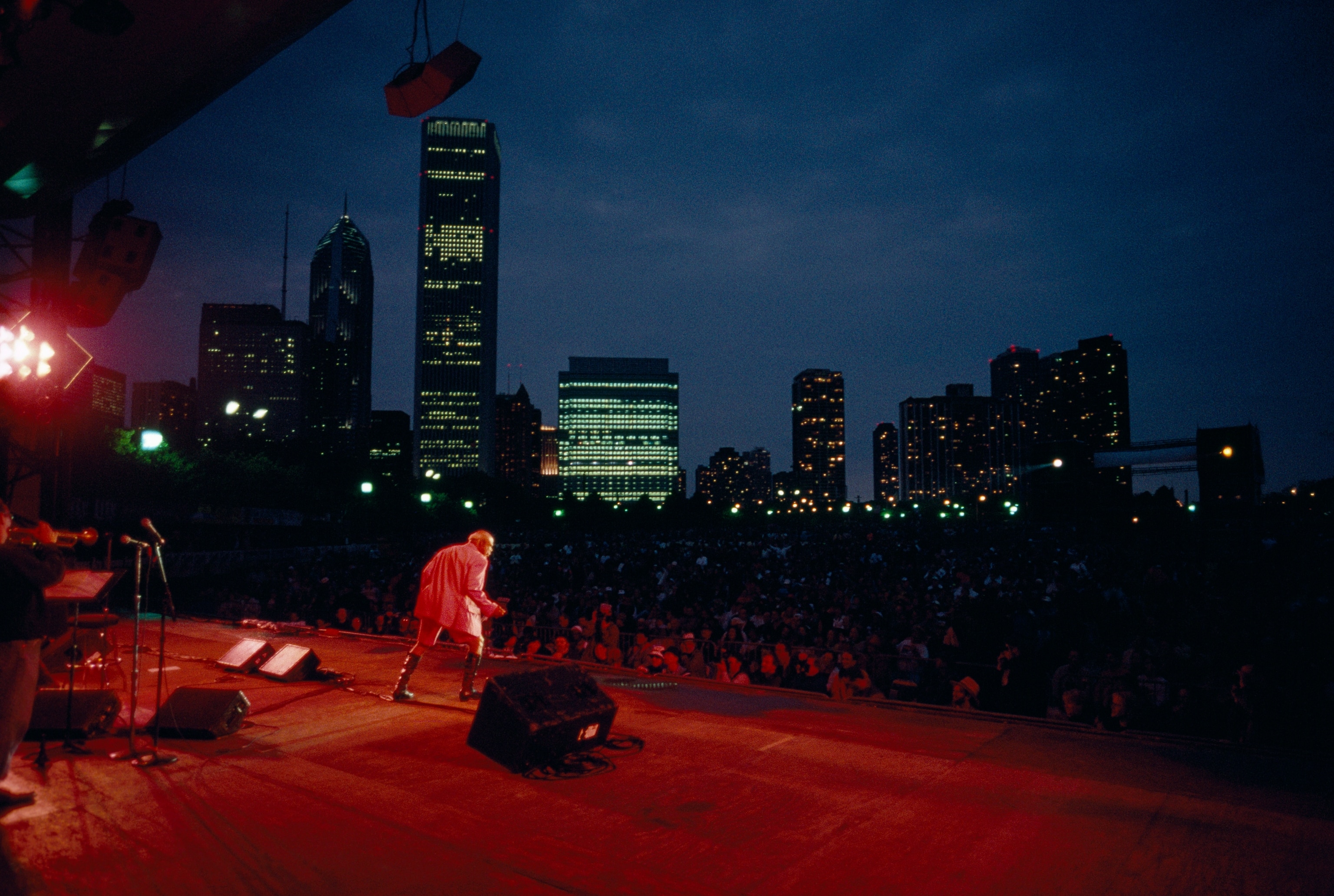 Upstaging his age, 80-year-old Rufus Thomas works the Chicago Blues Festival. Singer, dancer, and comedian, he promoted the blues in the 1950s as a disc jockey on WDIA in Memphis, the first radio station dedicated to black music. His own biggest hit was the novelty song "Walking the Dog."