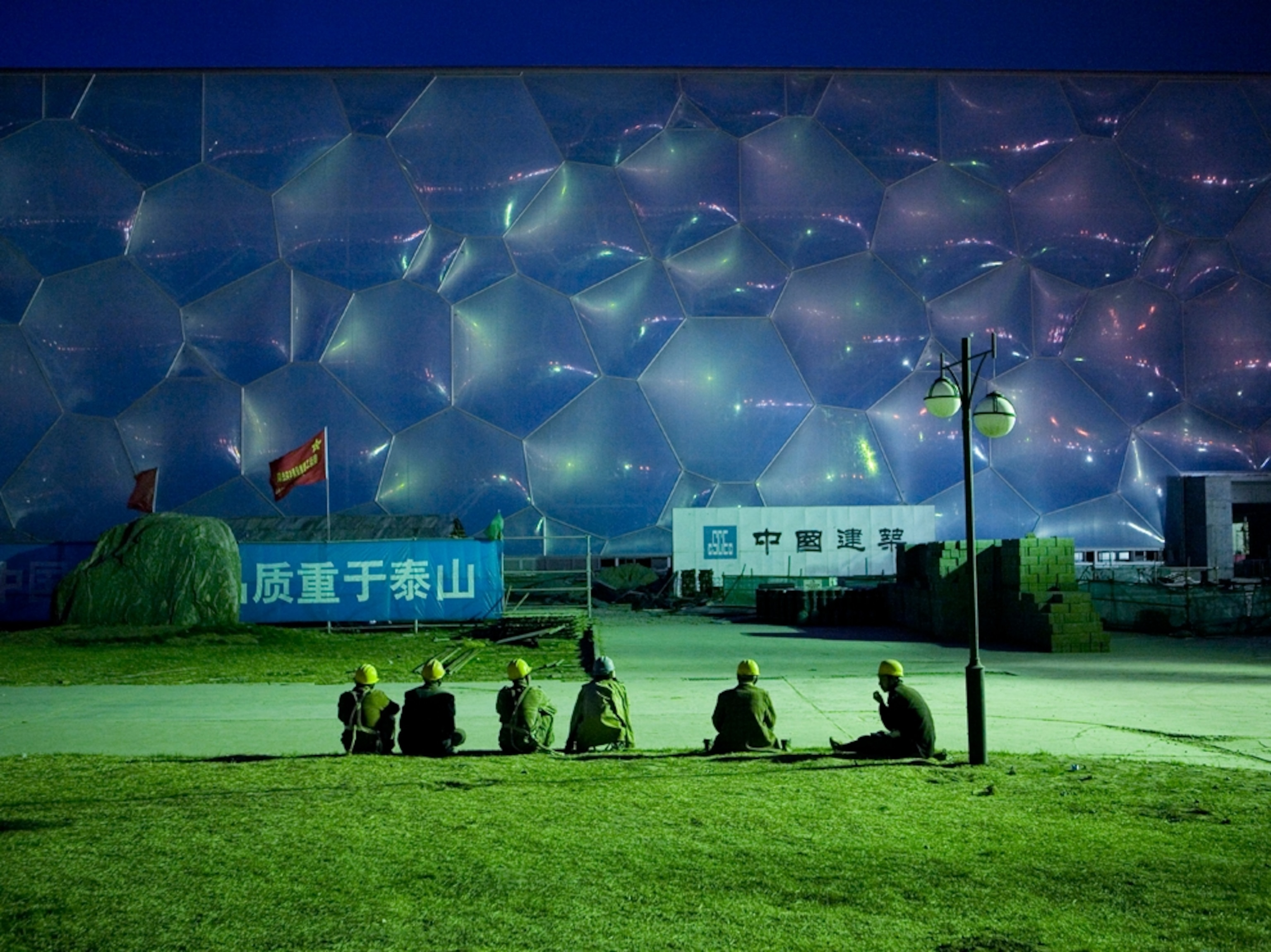 Construction workers at dusk, Water Cube, China