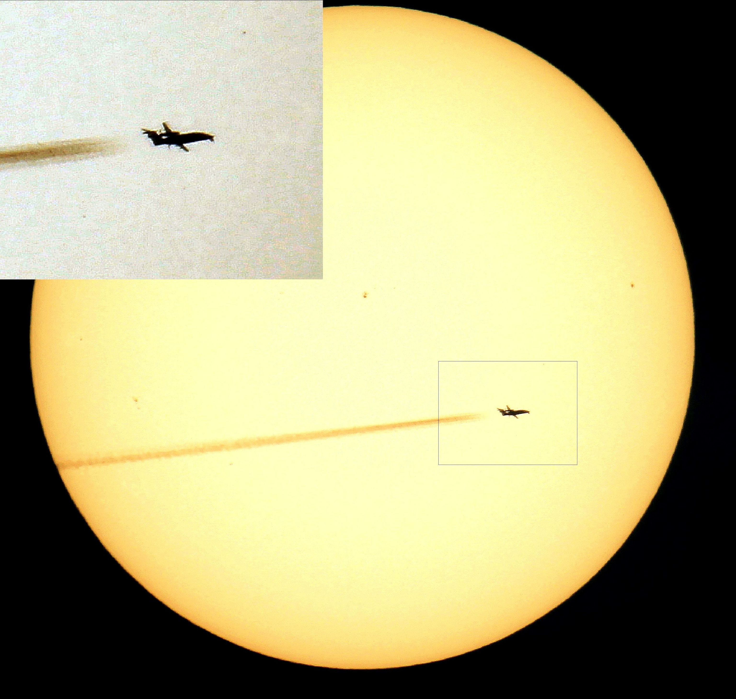 a plane flying past the sun