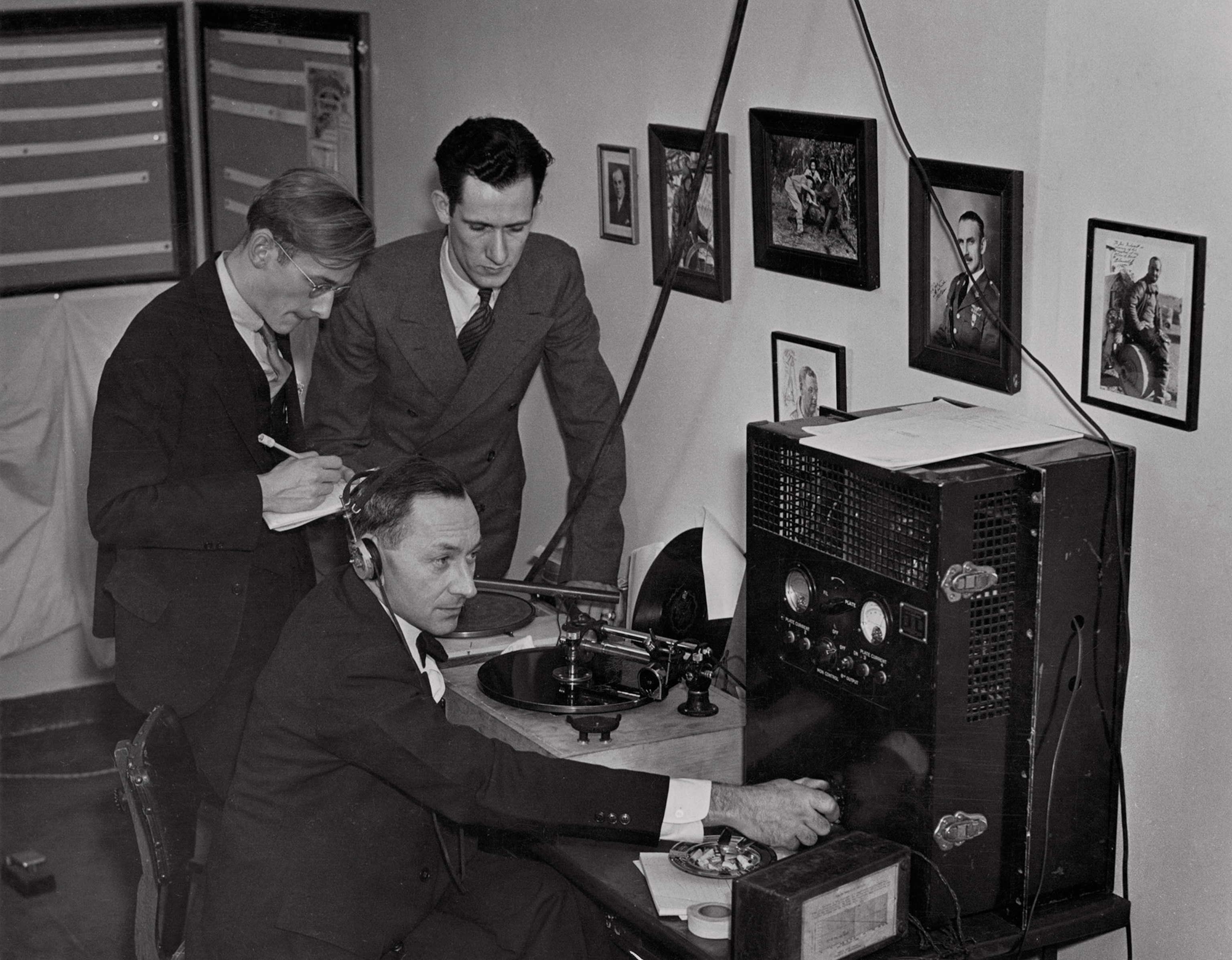 men listening to radio