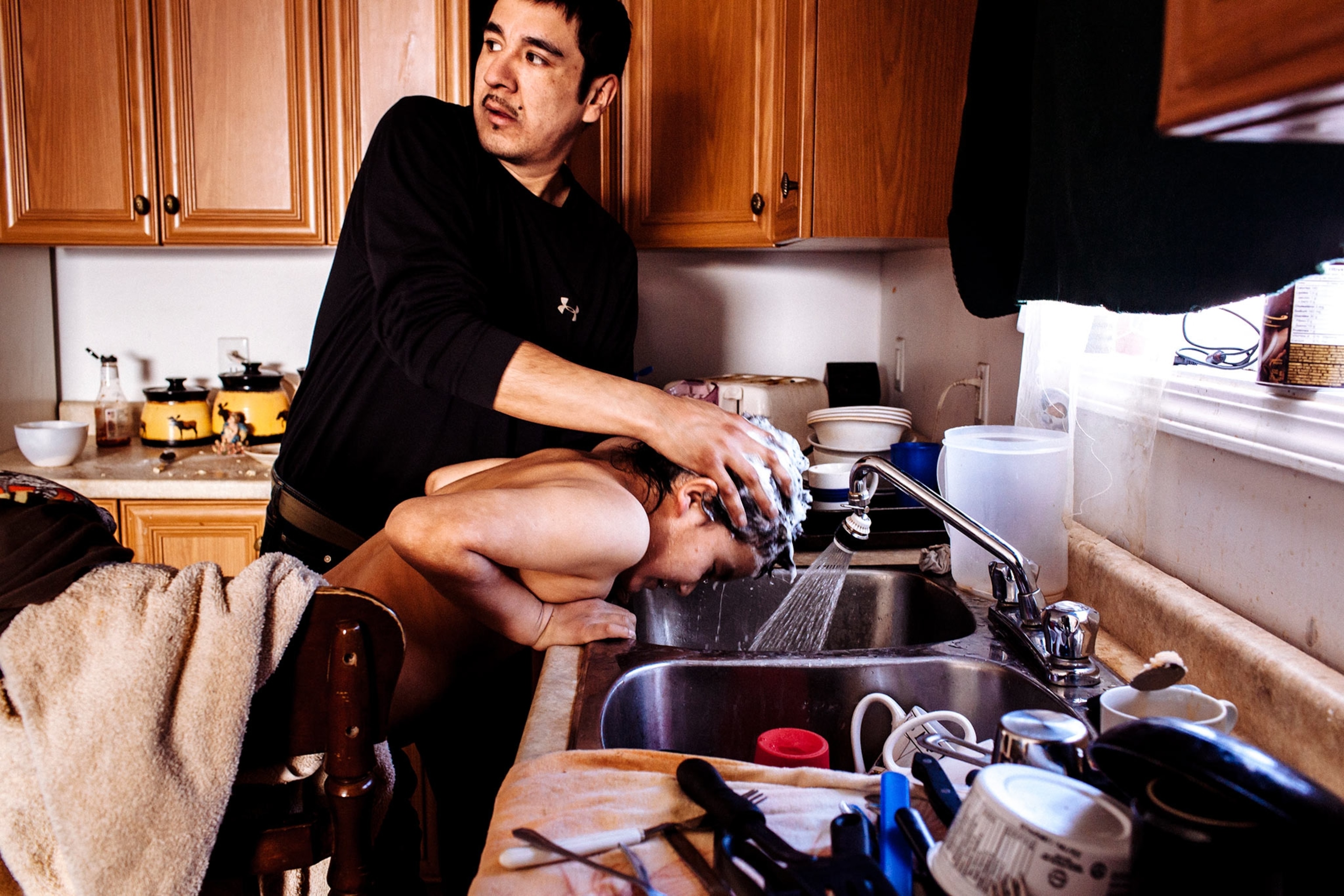 Anson washing son's hair