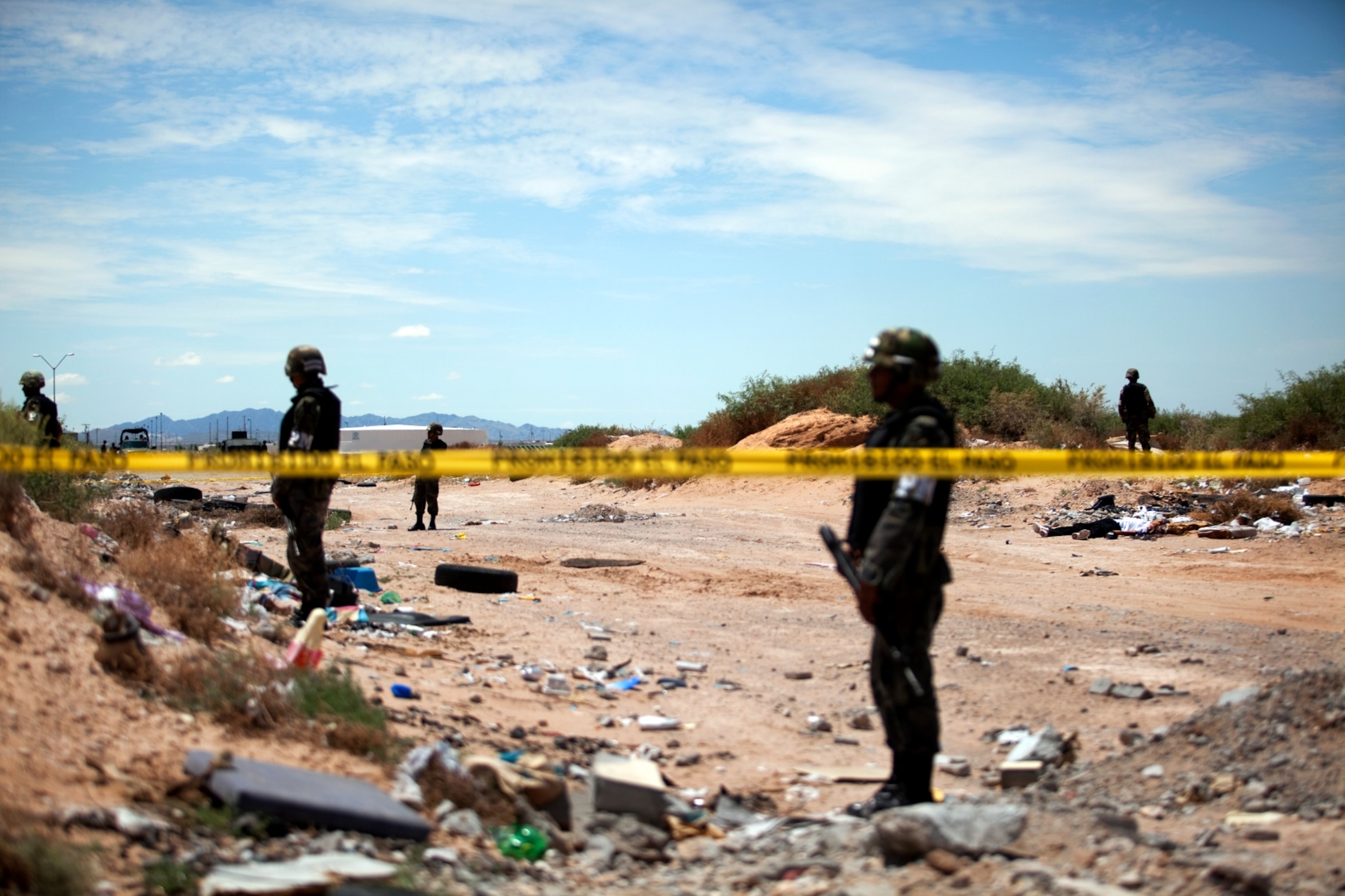 A crime scene investigation of two dead bodies found in the desert outside of Juarez. Mexico, on  Aug. 2, 2009.