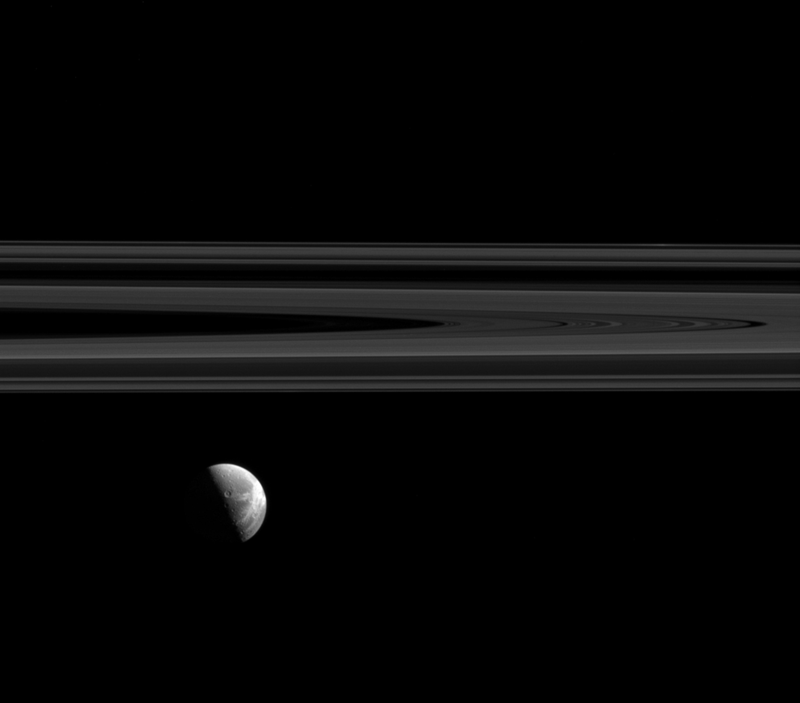 Dione near Saturn's rings