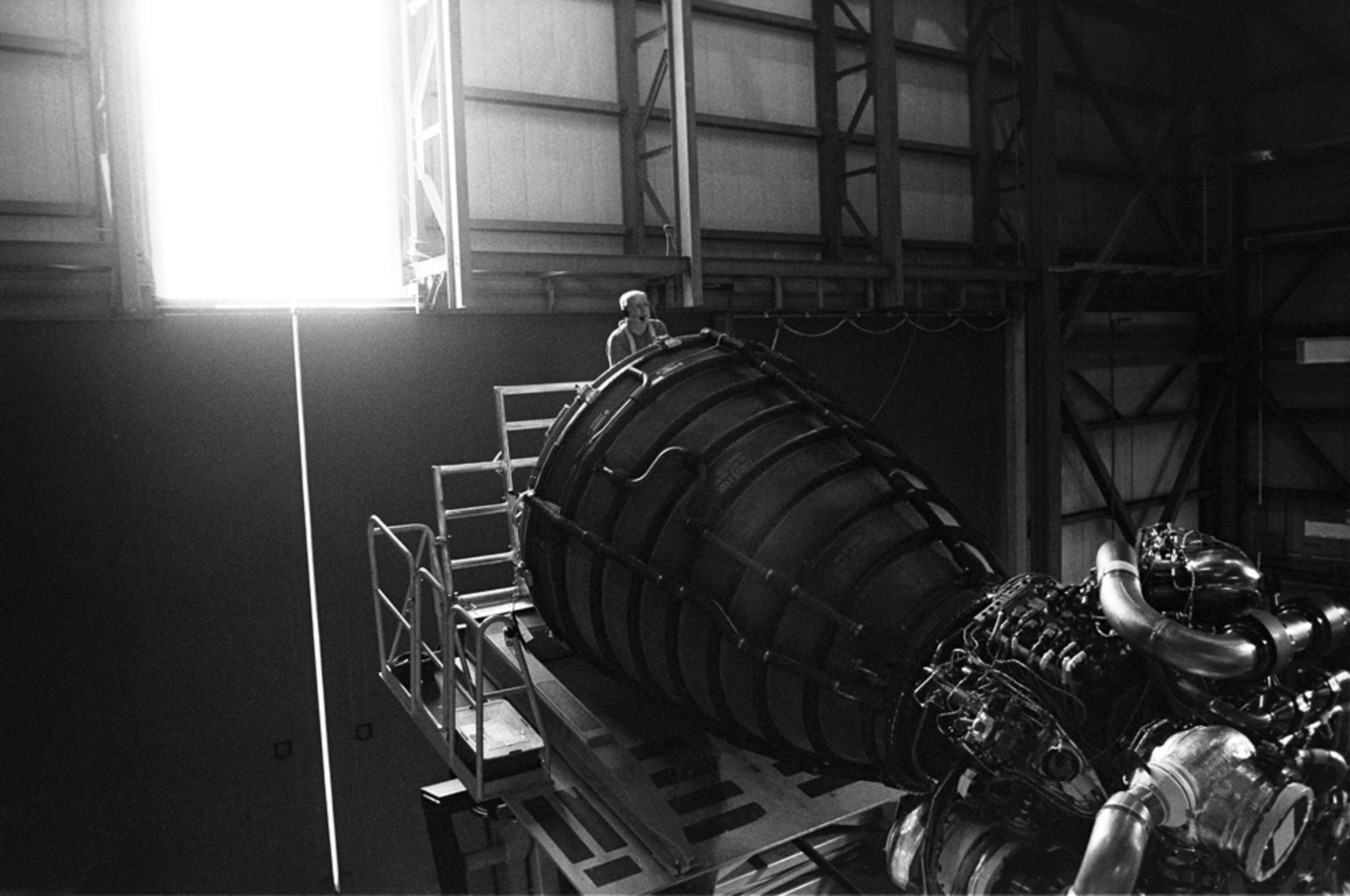a technician working on a space shuttle engine