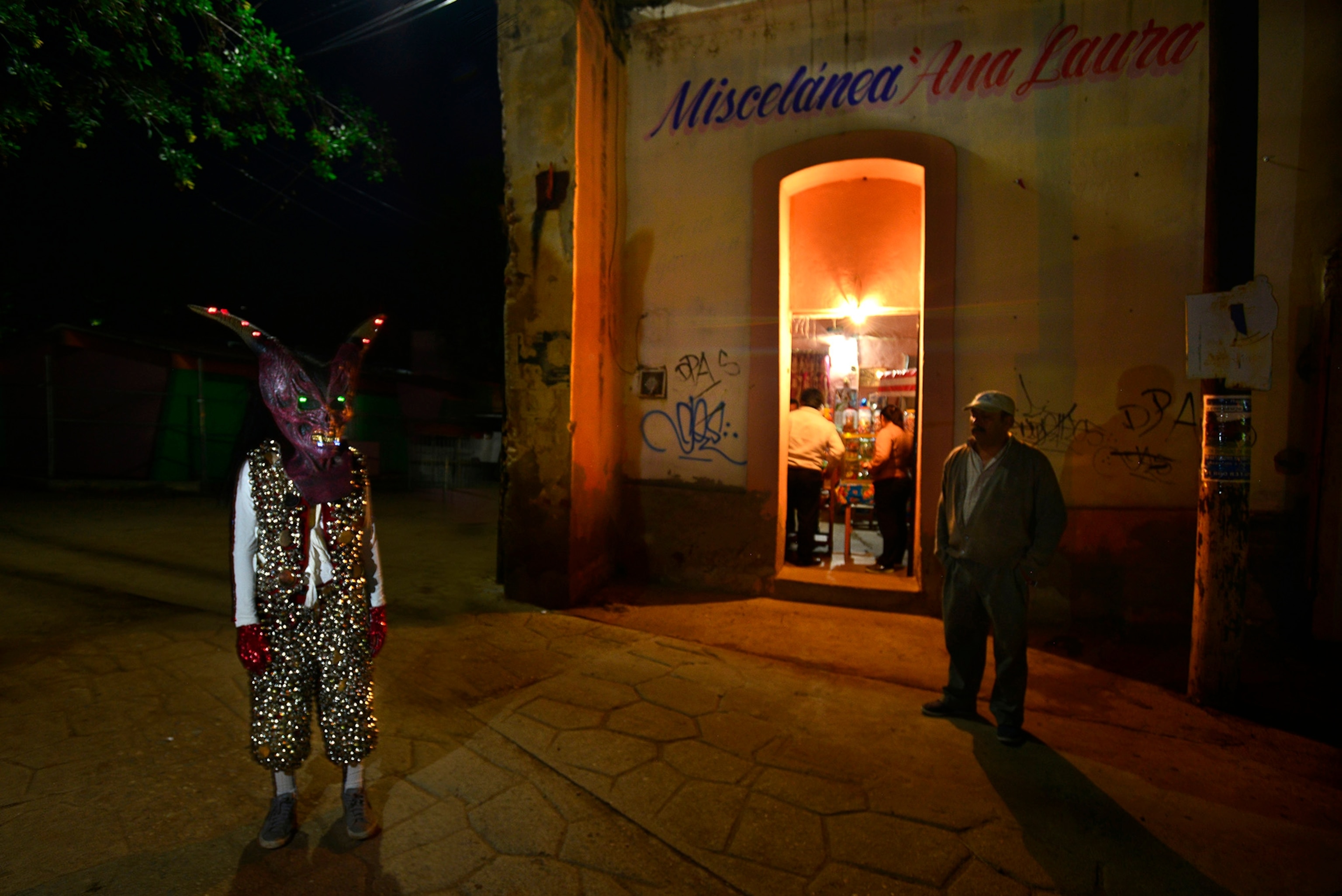 A person wearing a costume for a Day of the Dead street parade in San Jose Etla, Oaxaca, Mexico.