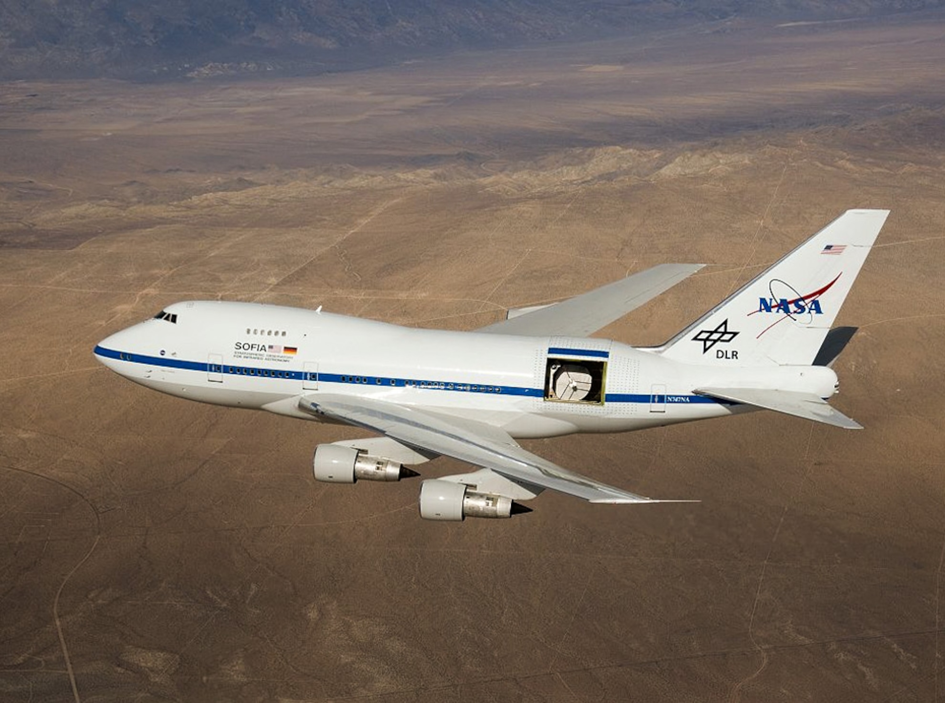 A telescope is exposed in flight aboard a modified plane