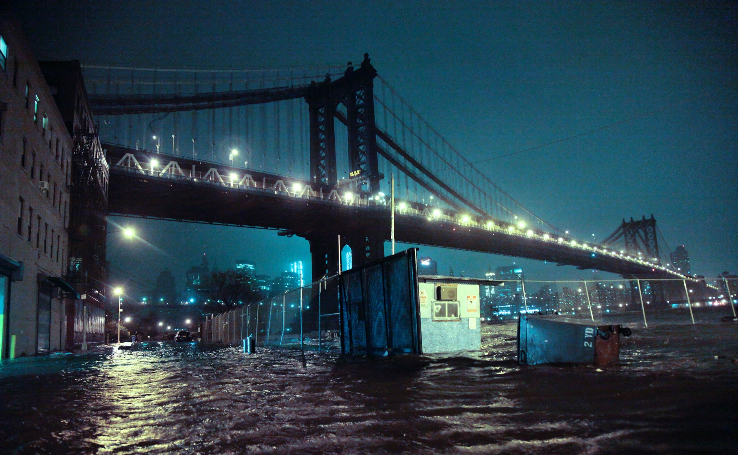 The Brooklyn boroughs of New York are flooded under the Manhattan Bridge as a surge of seawater is pushed into New York City by Superstorm Sandy.