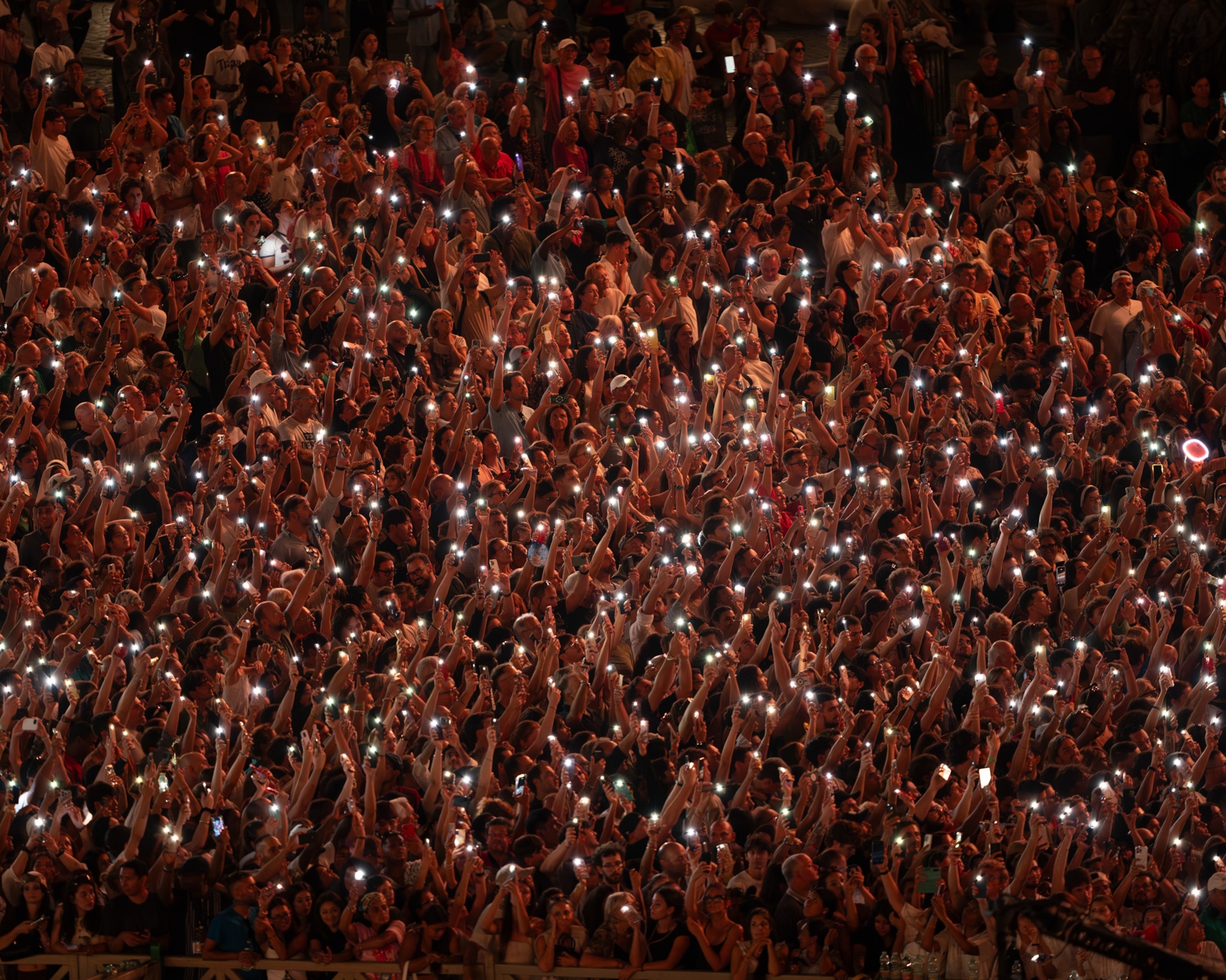 crowd of people holding lights