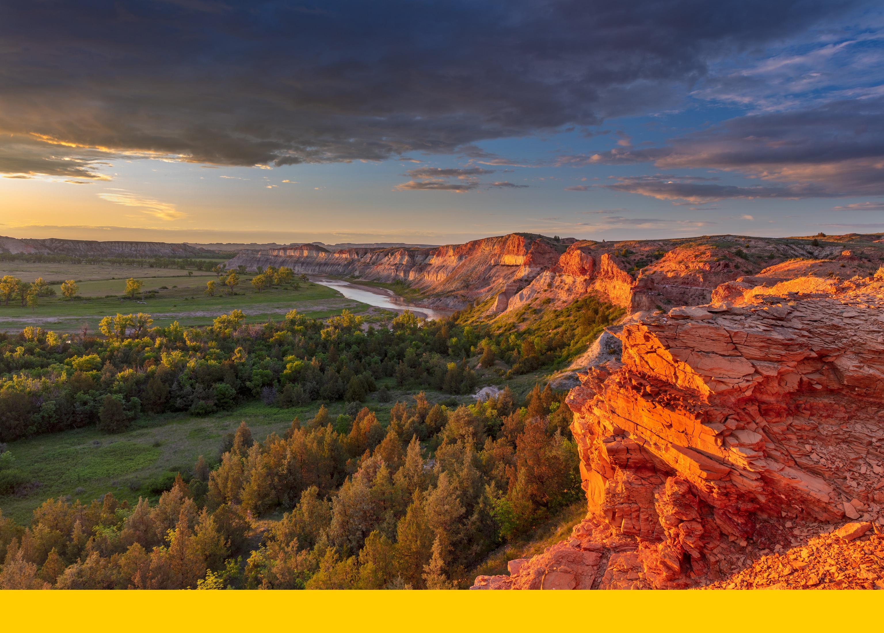 Dramatic light on cliffs over the Little Missouri River in the Little Missouri National Grasslands, North Dakota, USA