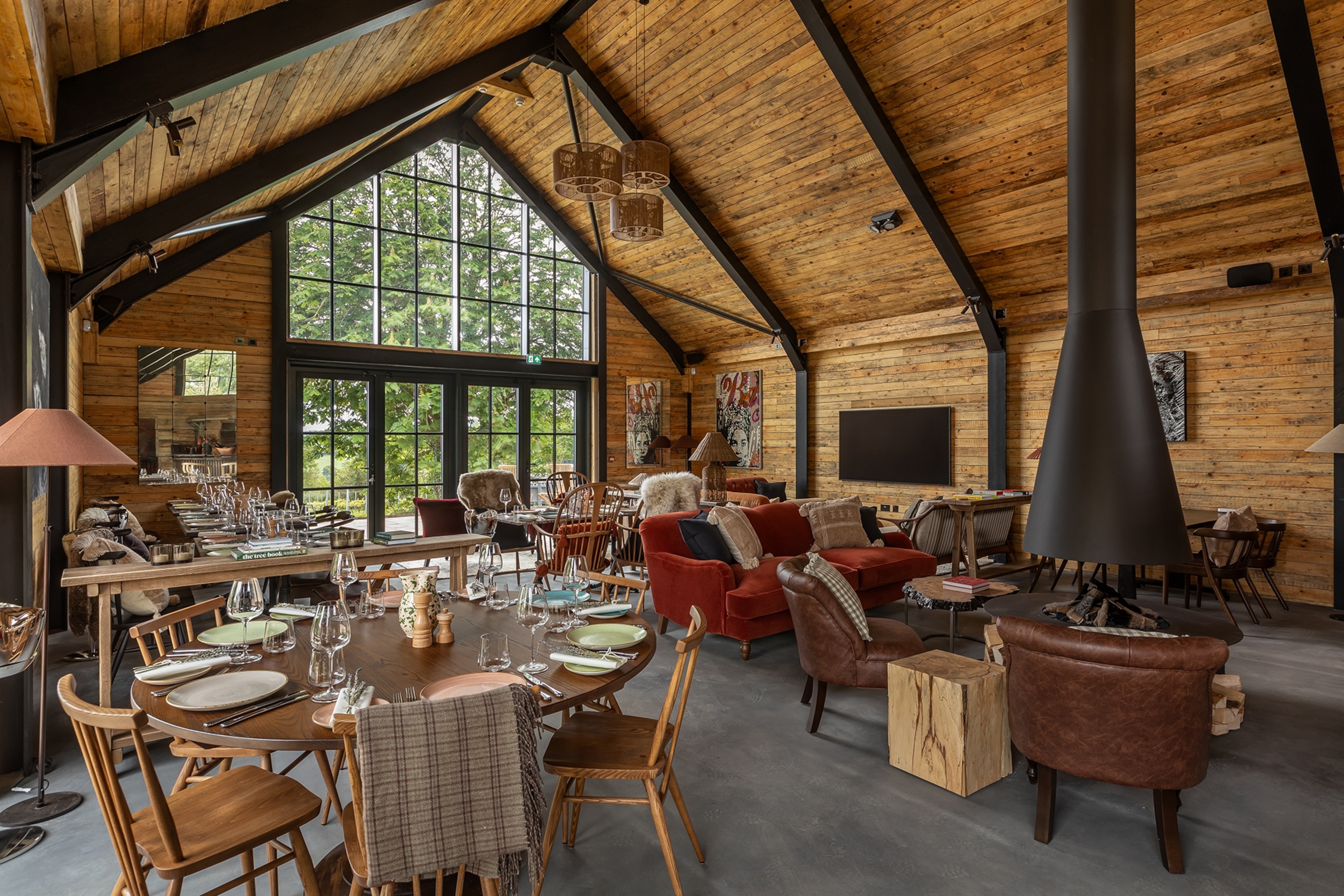 a lounge in a hotel with a fireplace
