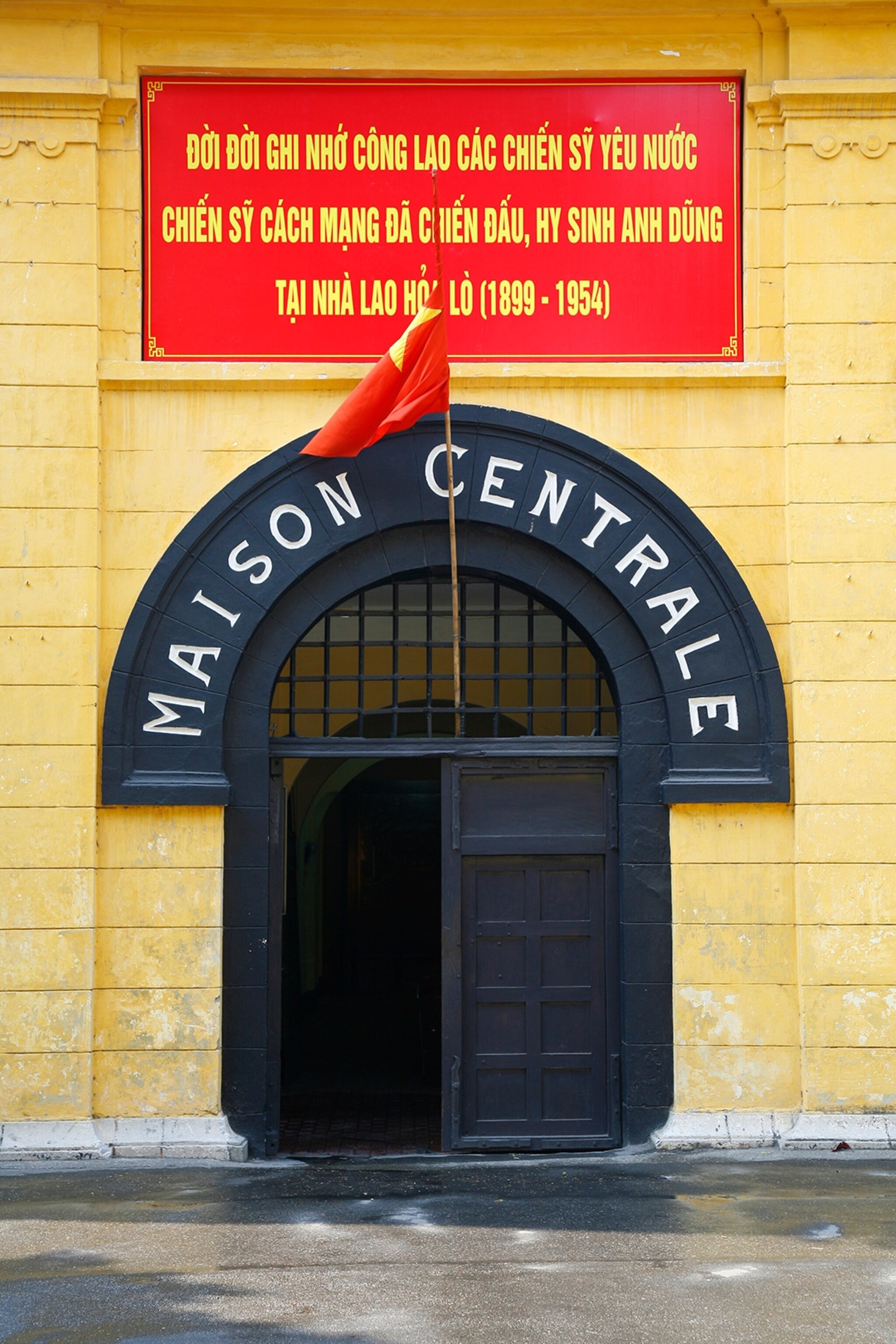 The door to Hoa La Prison with its old French name, Maison Centrale above the door.