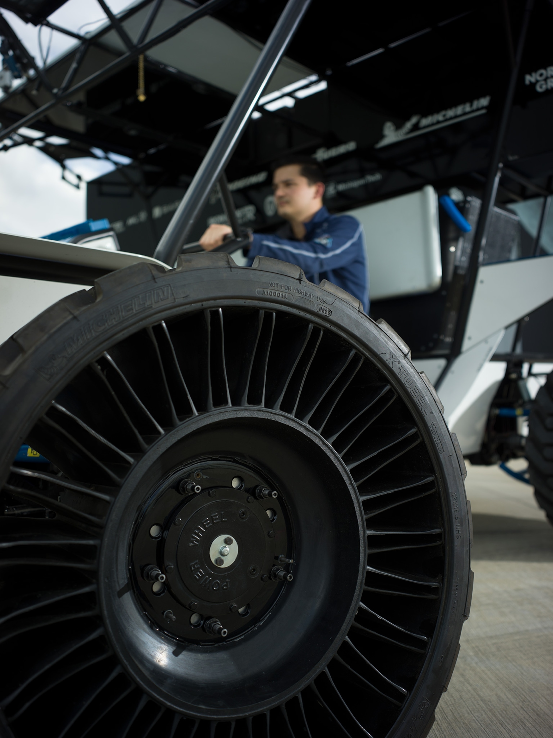 large tire in foreground man in background
