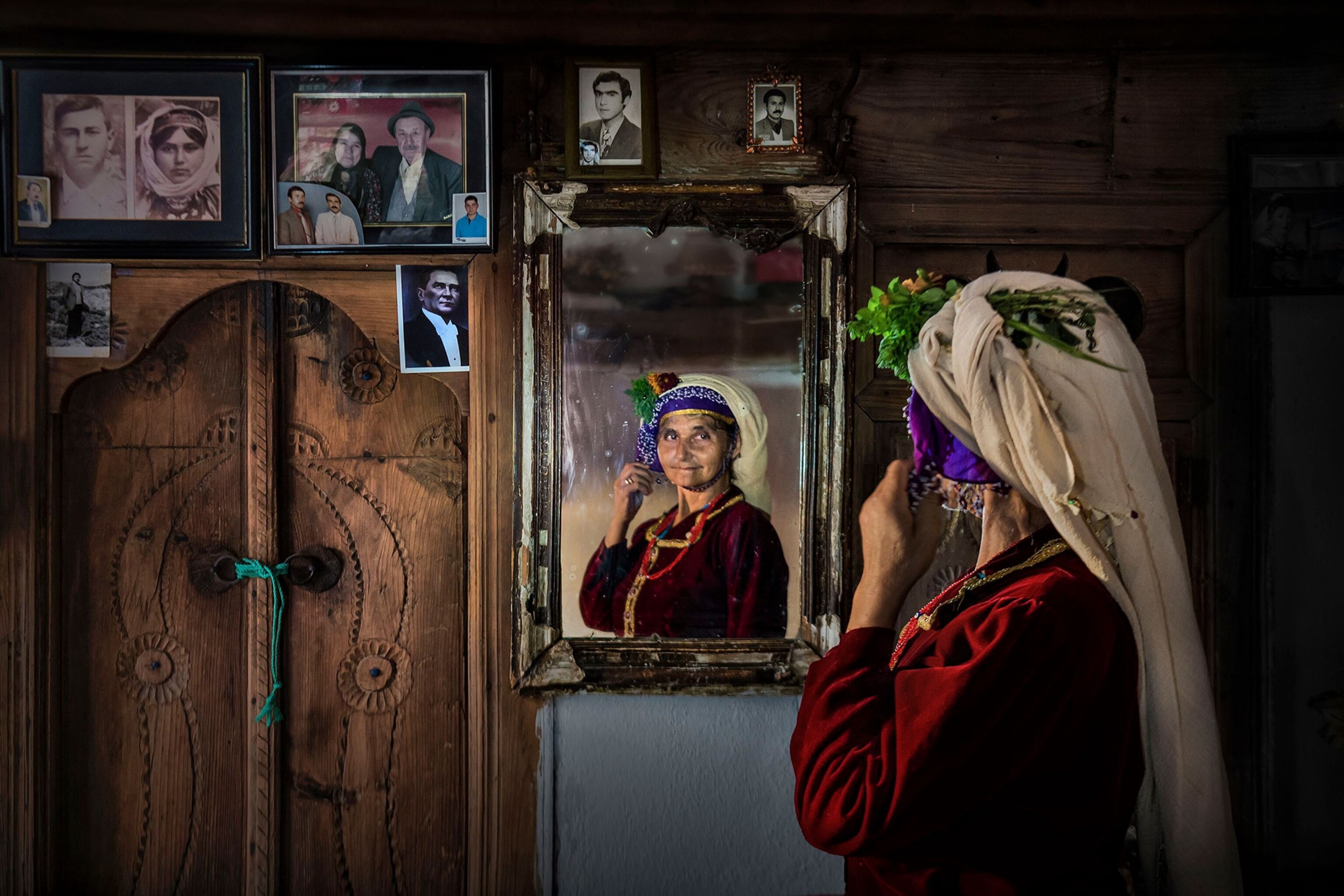 a woman looking in the mirror