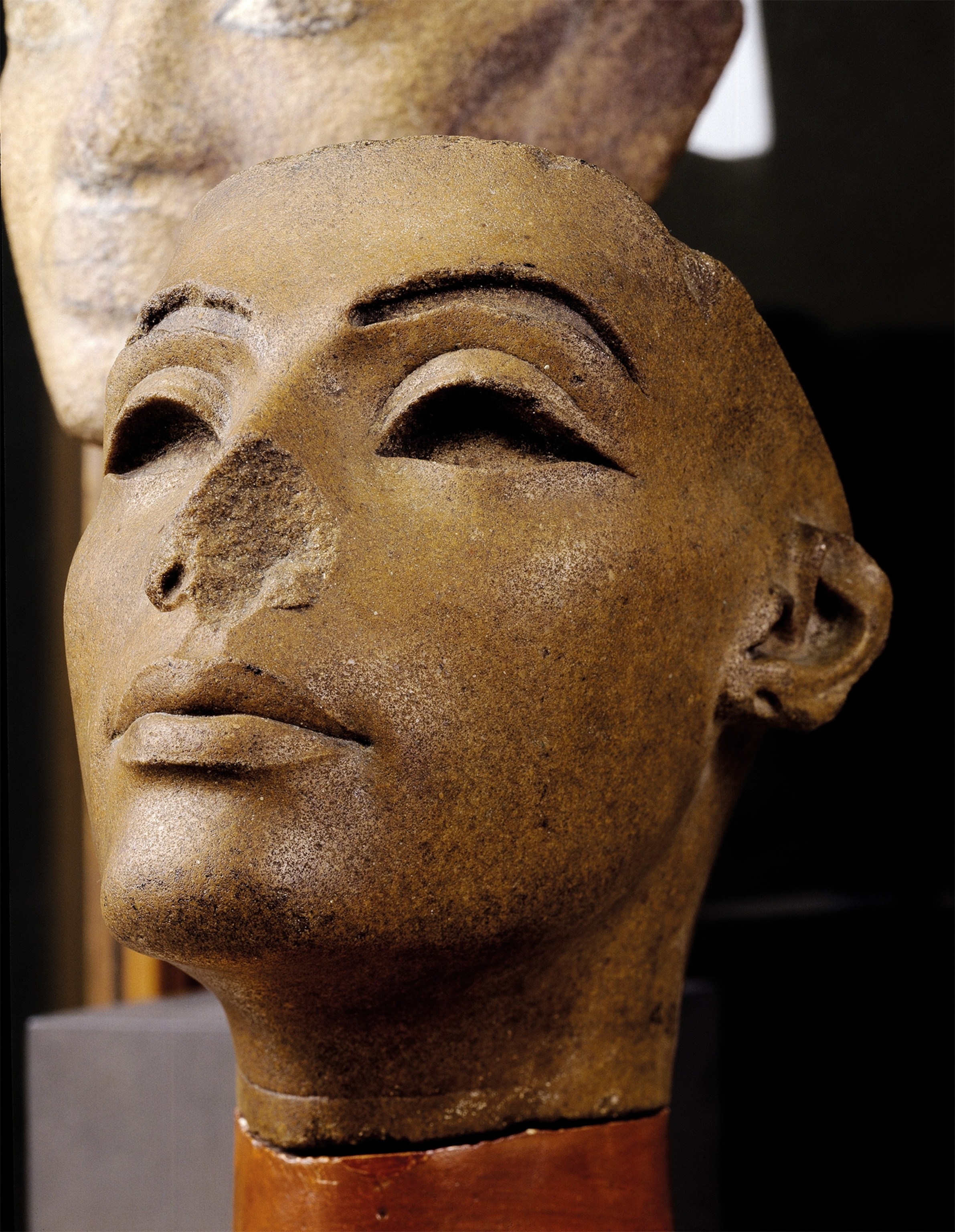 Damage to the nose mars the appearance of an exquisitely rendered quartzite head from Memphis, housed in Cairo's Egyptian Museum, that is believed to represent Nefertiti.