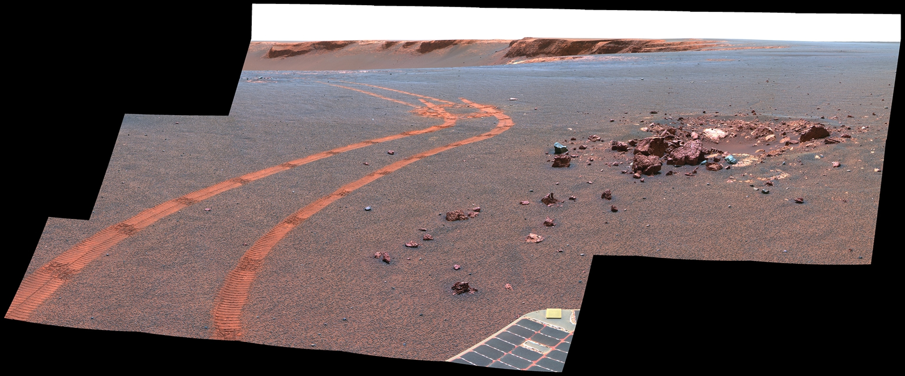 NASA's Mars Exploration Rover Opportunity captured this view of "Burns Cliff" after driving right to the base of this southeastern portion of the inner wall of "Endurance Crater." The view combines frames taken by Opportunity's panoramic camera between the rover's 287th and 294th martian days (Nov. 13 to 20, 2004).