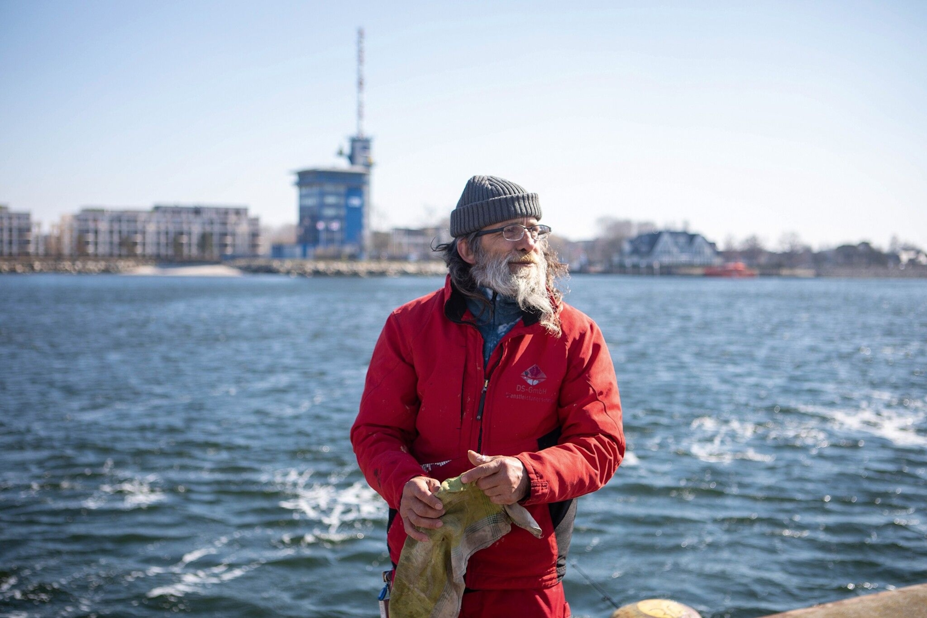 A fisherman fishing for herring in Warnemünde.