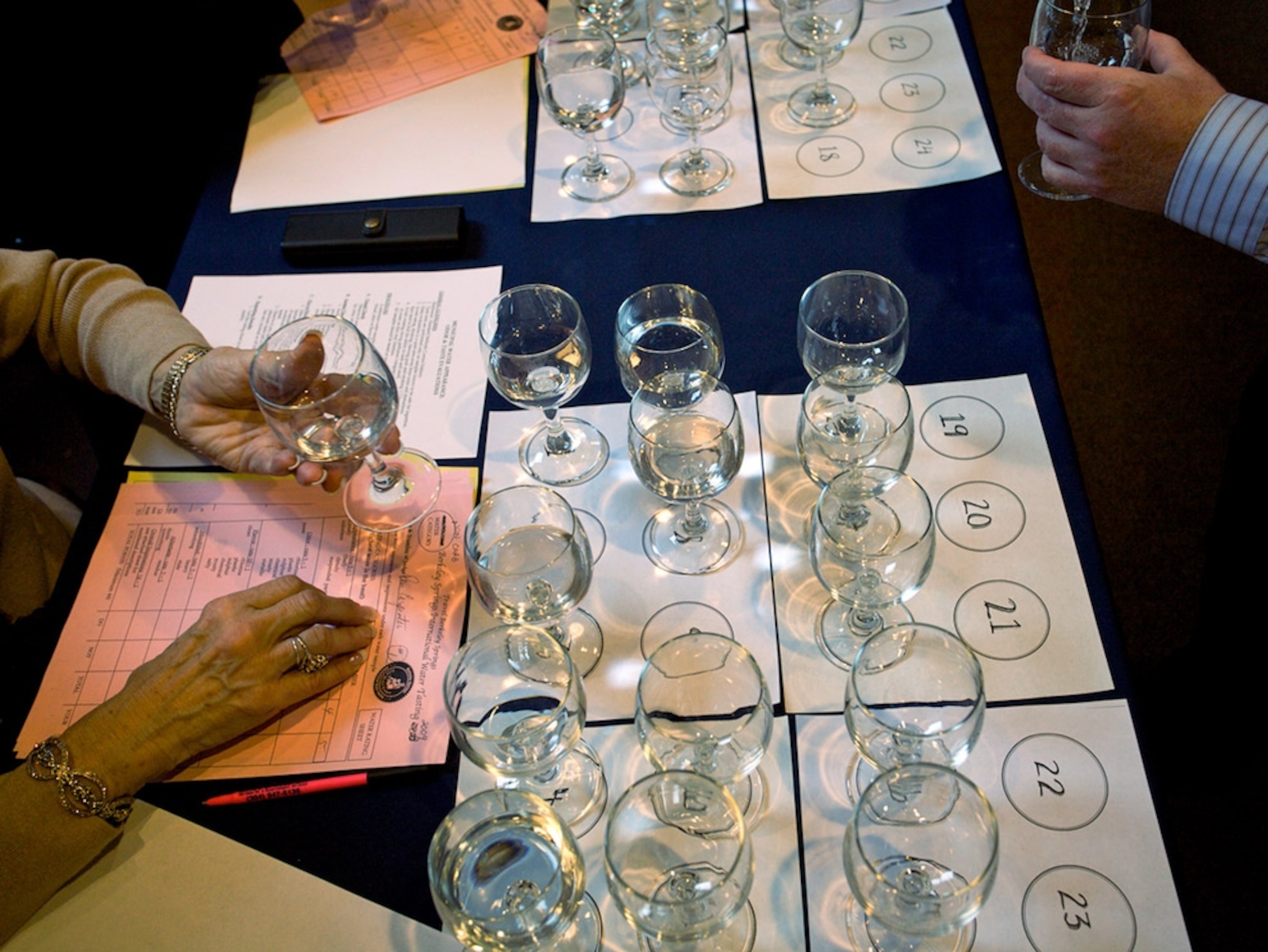 Glasses of water on numbered sheets of paper