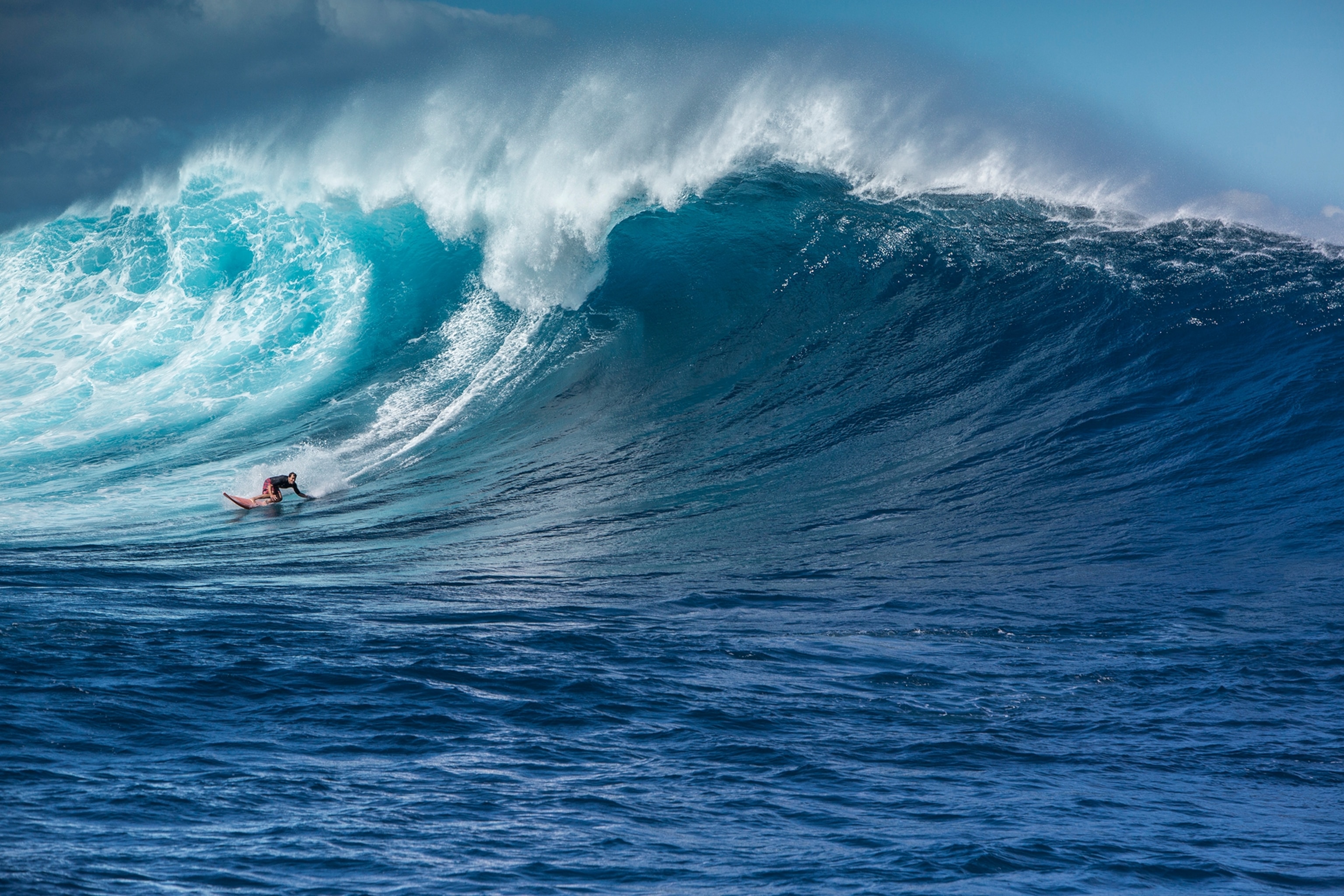 Surfer Mike Pietsch goes left at Peahi (JAWS) on a giant wave.