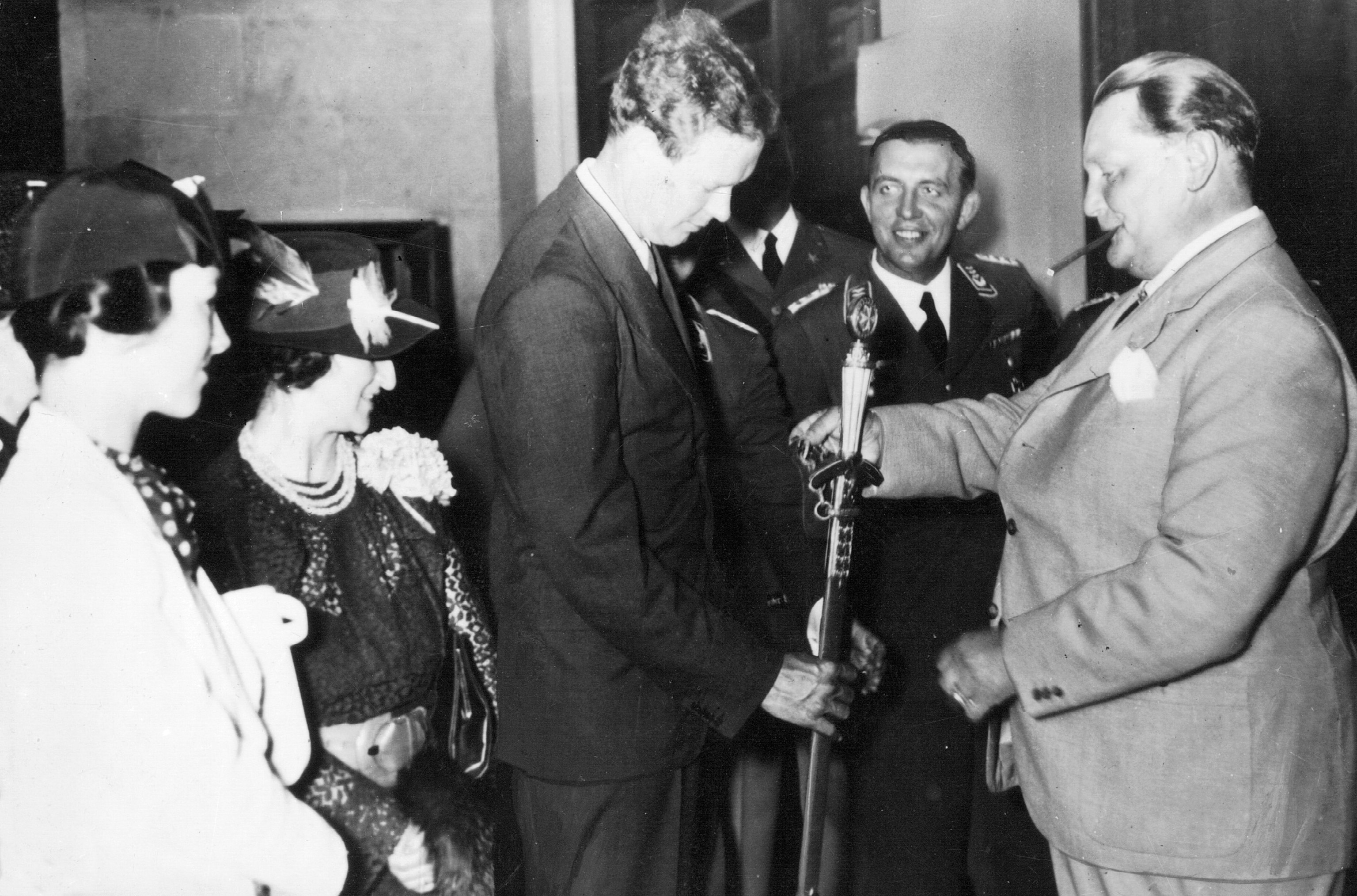 Charles Lindbergh receiving a medal from Hermann Goering with three other people watching
