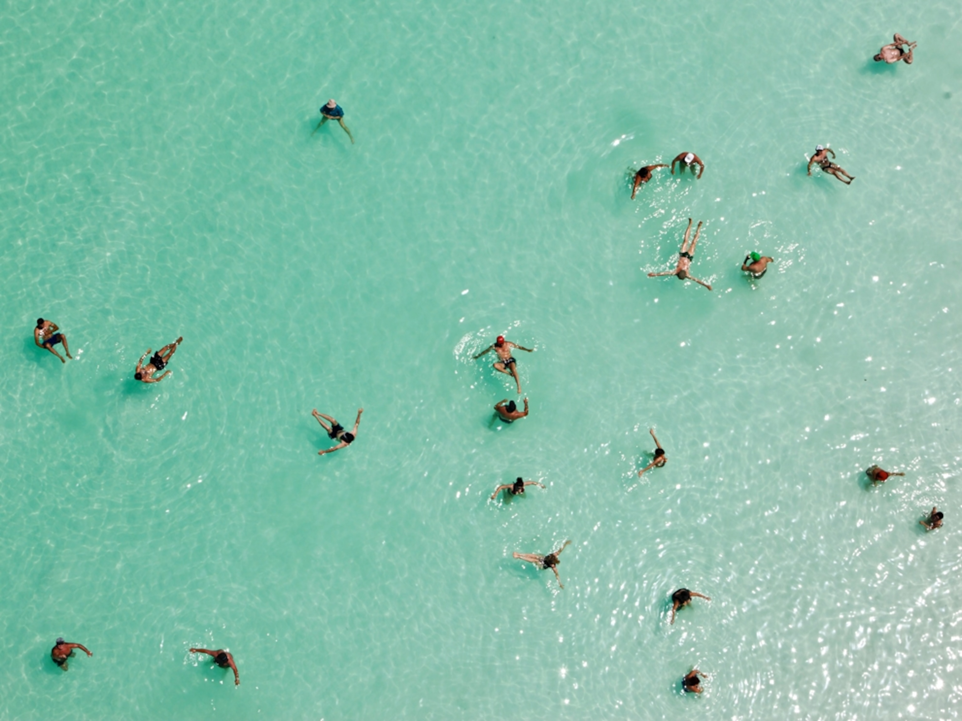 swimmers floating in the Dead Sea, Israel