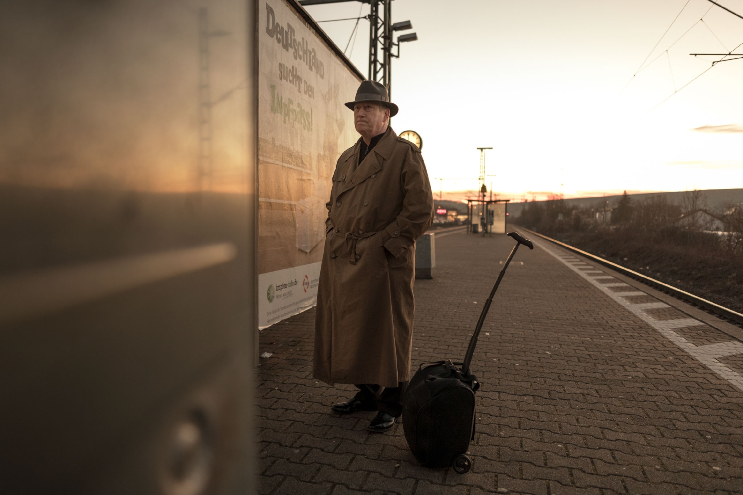 a man standing on a train platform