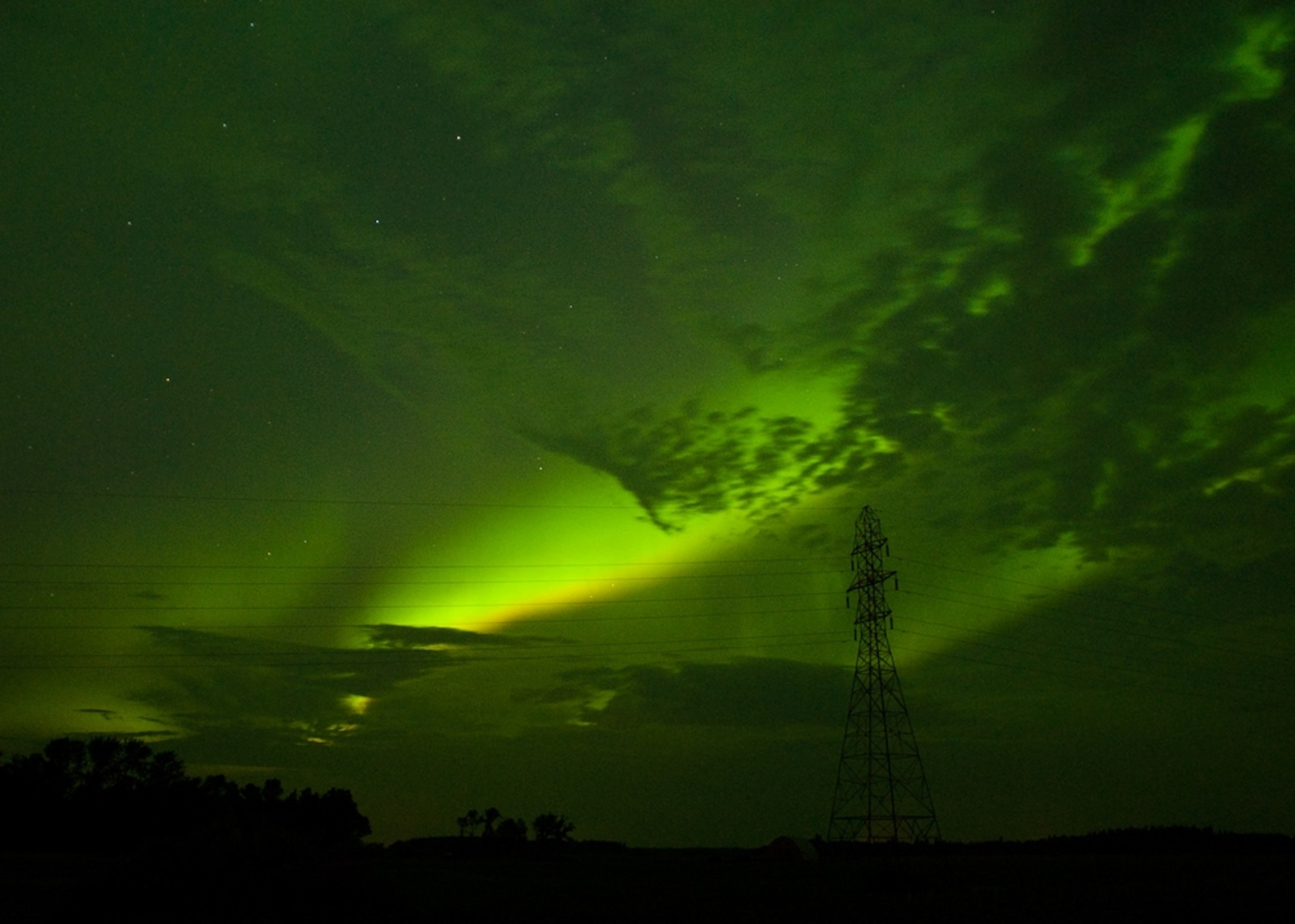 Picture of green skies over Manitoba, Canada, produced by auroras.