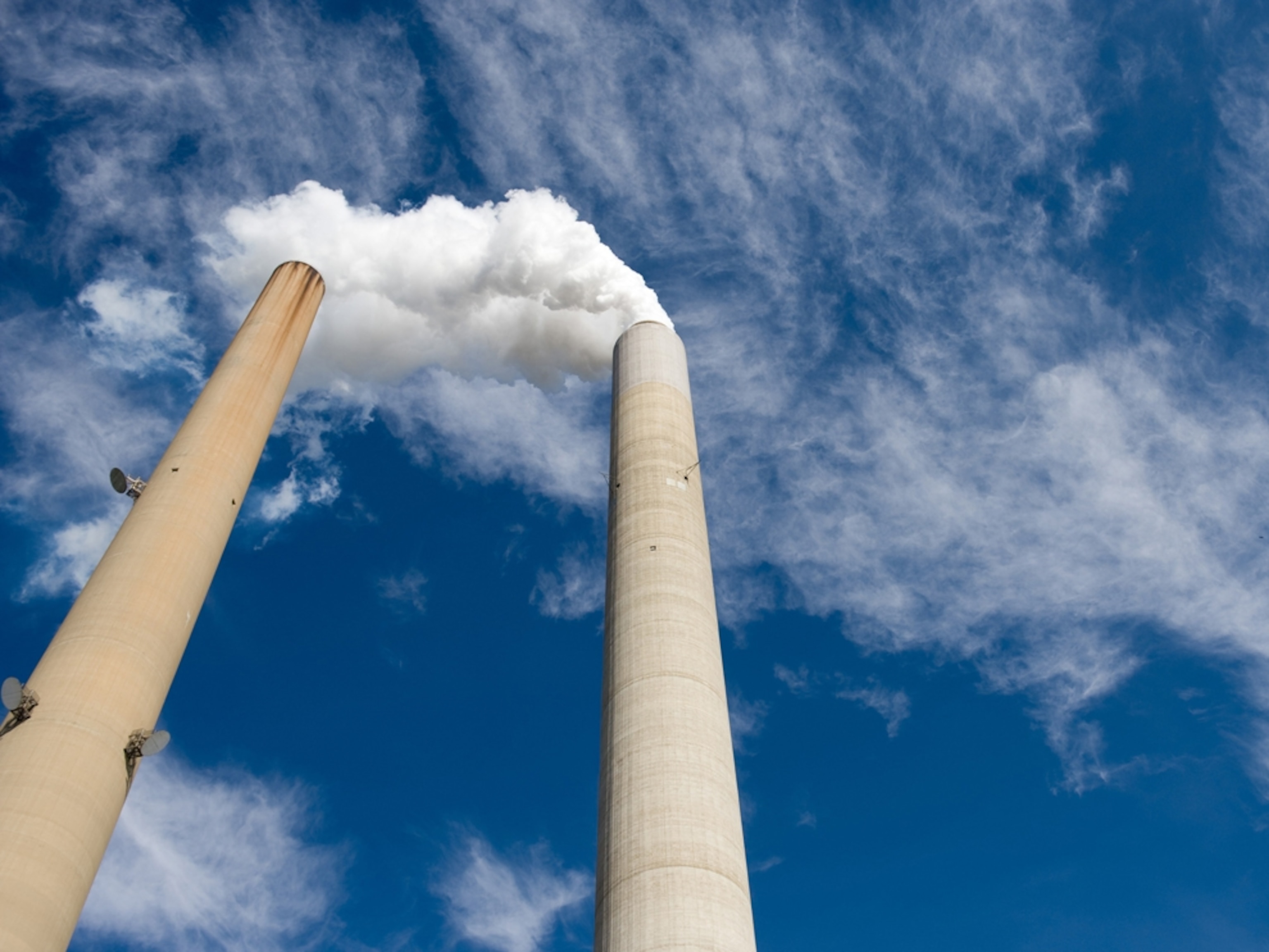 The smoke stacks at American Electric Power's (AEP) Mountaineer coal power plant in New Haven, West Virginia, October 30, 2009. In cooperation with AEP, the French company Alstom unveiled the world's largest carbon capture facility at a coal plant, so called "clean coal," which will store around 100,000 metric tonnes of carbon dioxide a year 2.1 kilometers (7,200 feet) underground. AFP PHOTO / Saul LOEB (Photo credit should read SAUL LOEB/AFP/Getty Images)